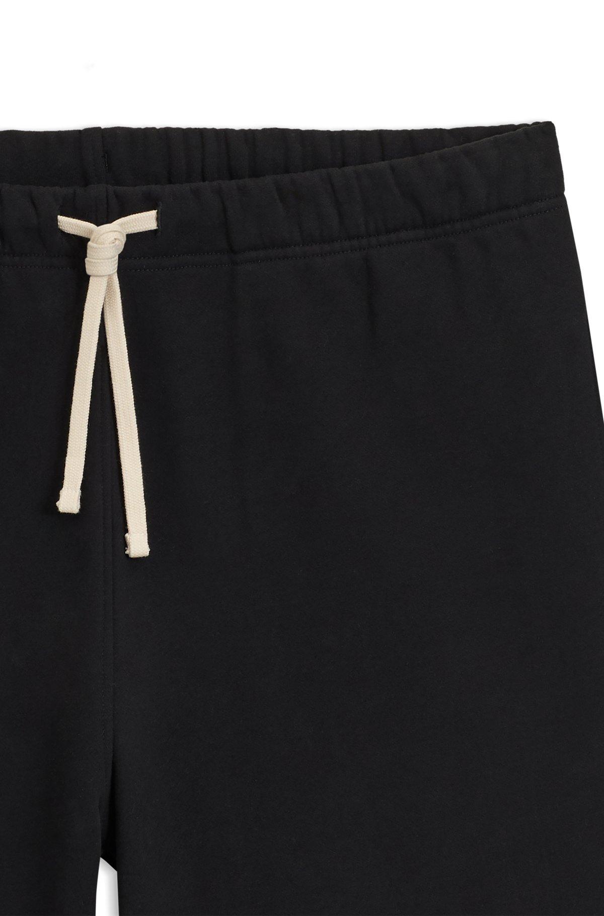 BOSS - BECKHAM x BOSS oversized-fit shorts in cotton terry - Black Product Image