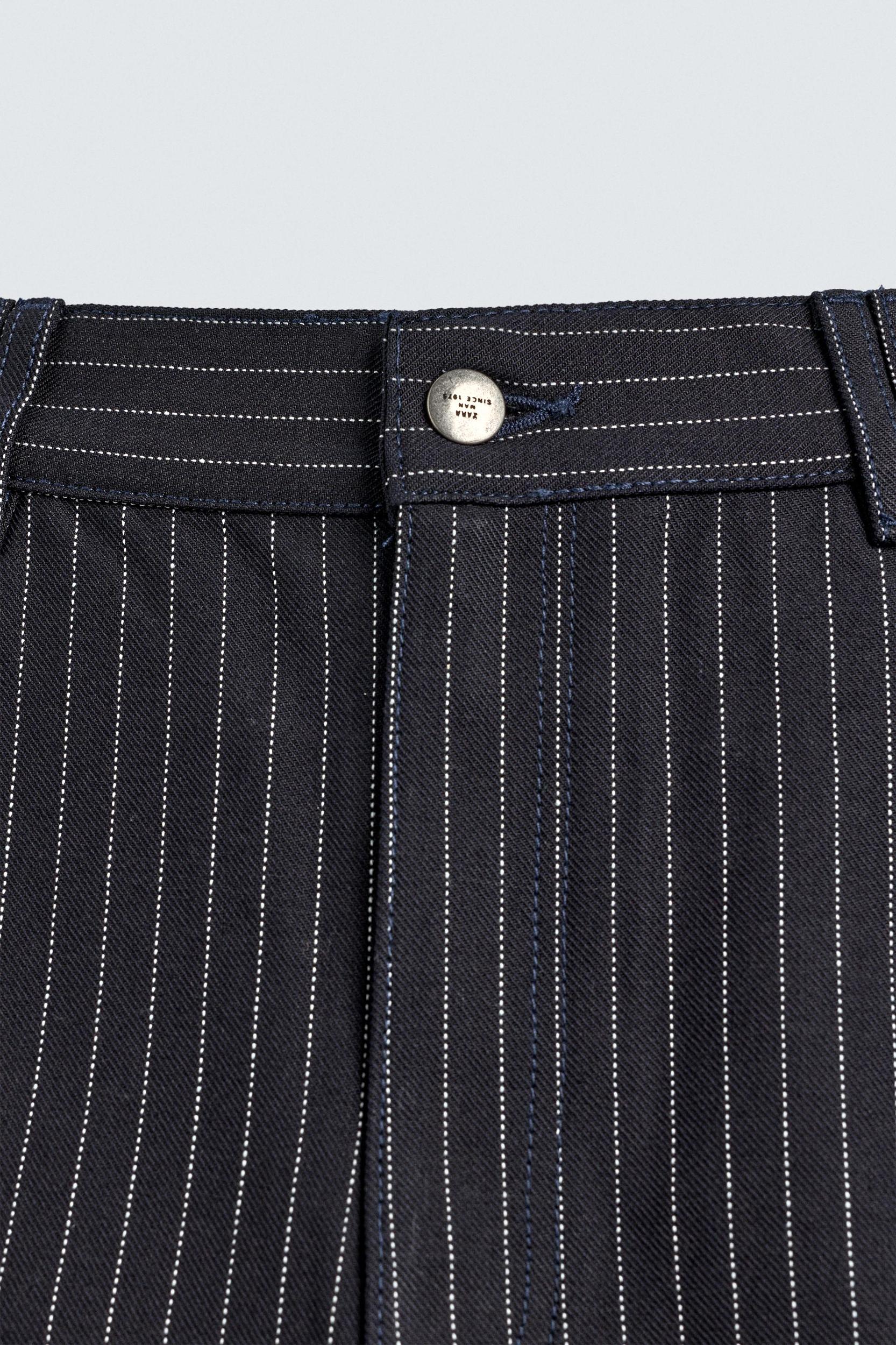 PINSTRIPED PLEATED SHORTS Product Image