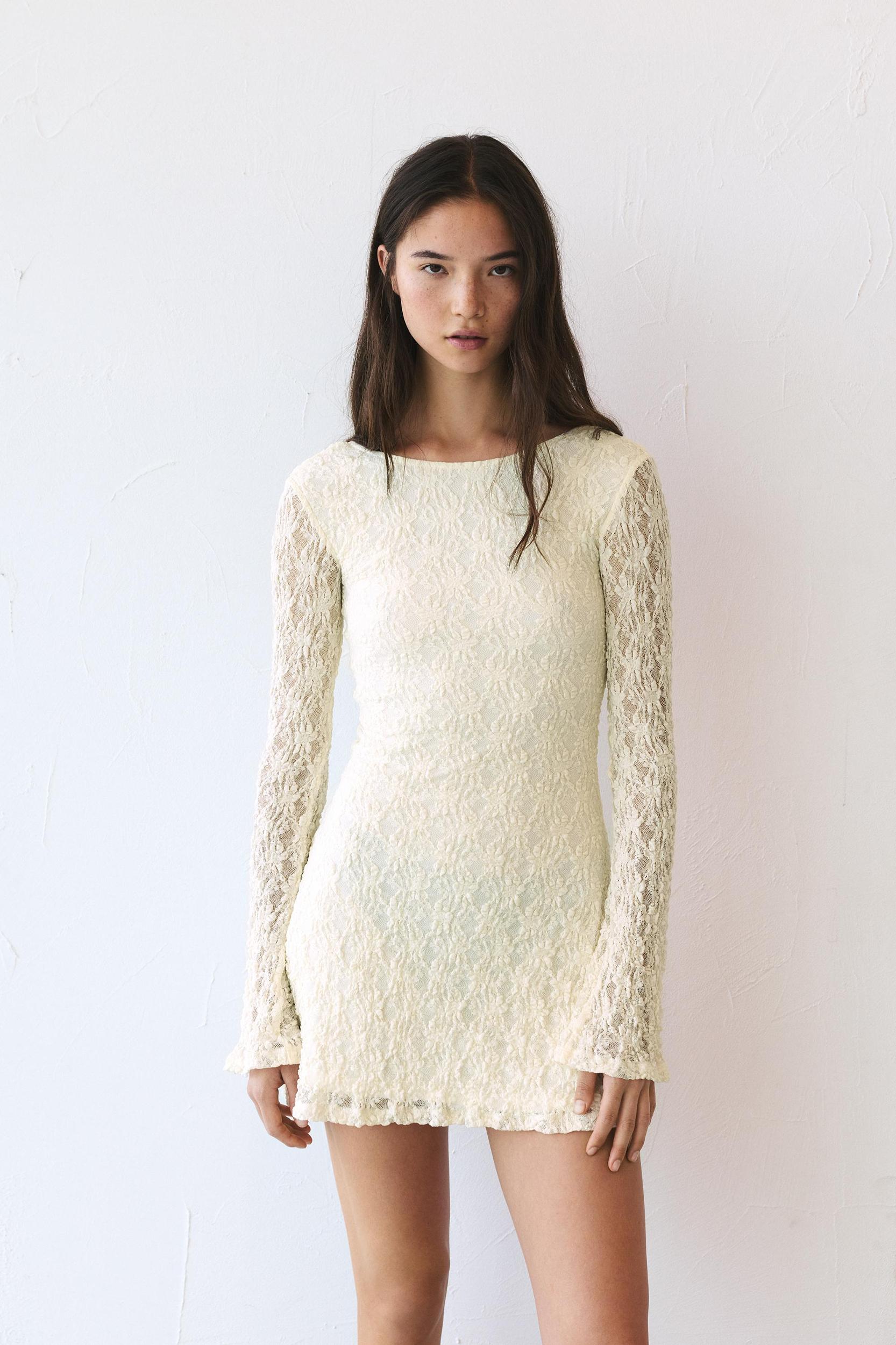 Short lace dress with long sleeves Product Image