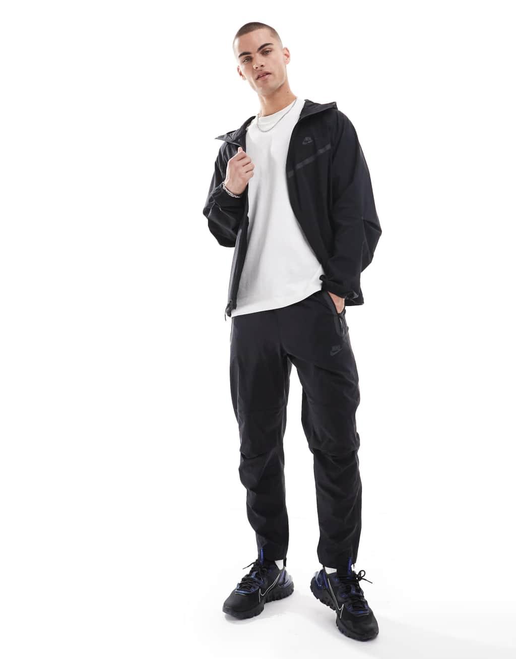 Nike Tech Woven full zip hoodie in black Product Image