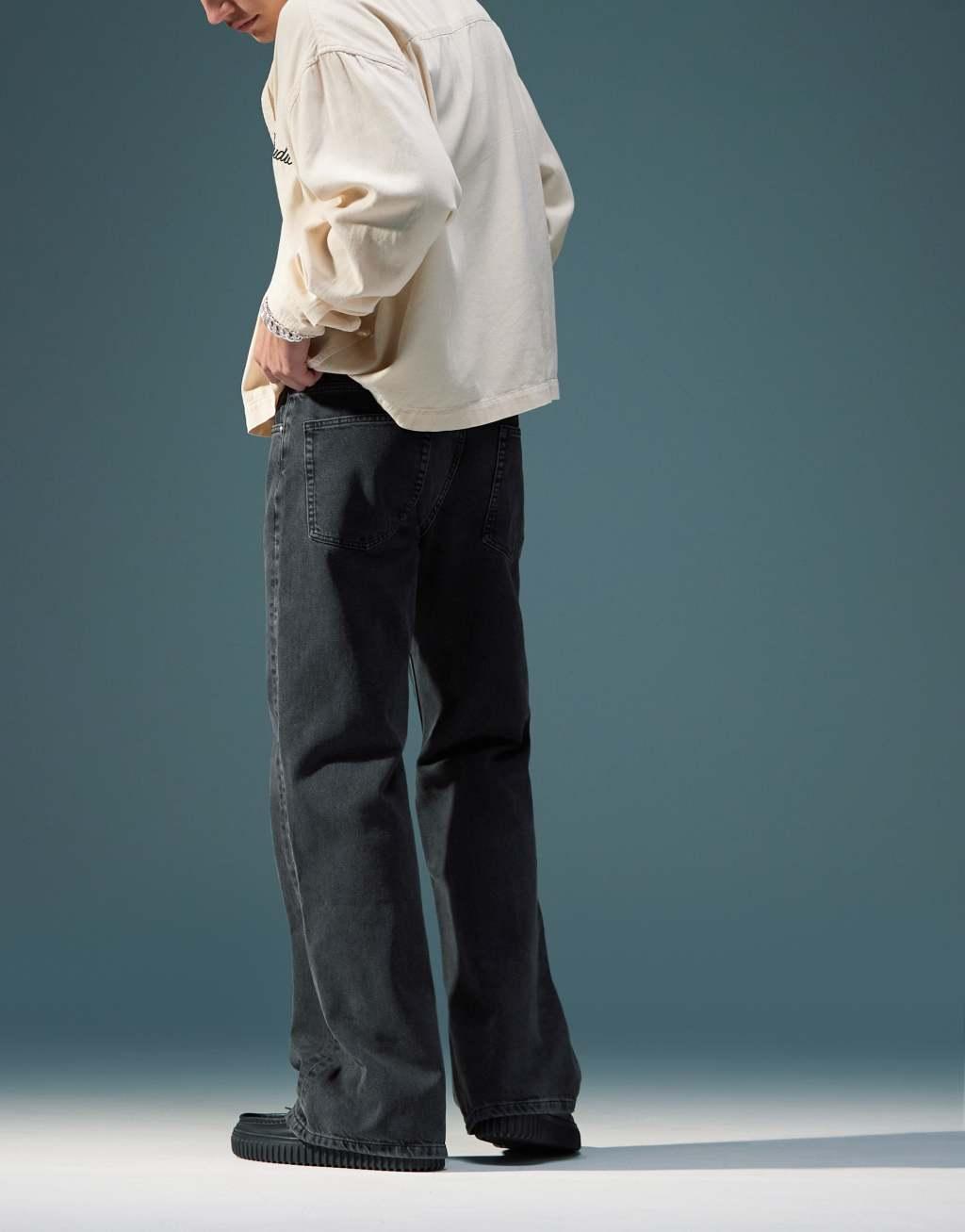 ASOS DESIGN wide flare jeans in washed black Product Image