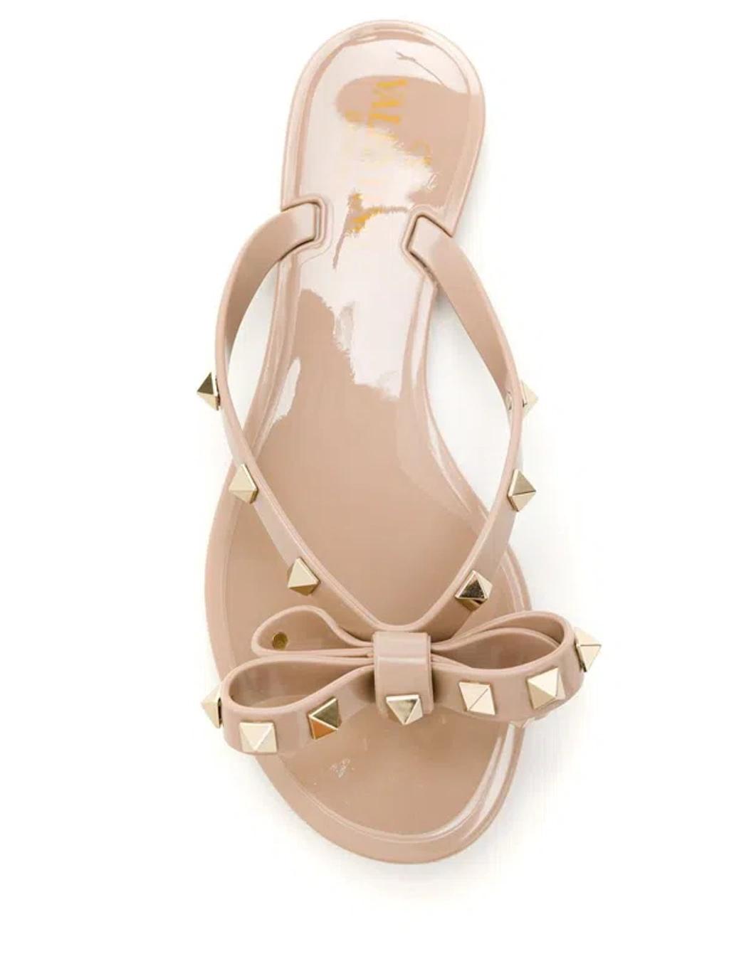 VALENTINO GARAVANI Women Rockstud Rubber Flip Flops In Beige Product Image