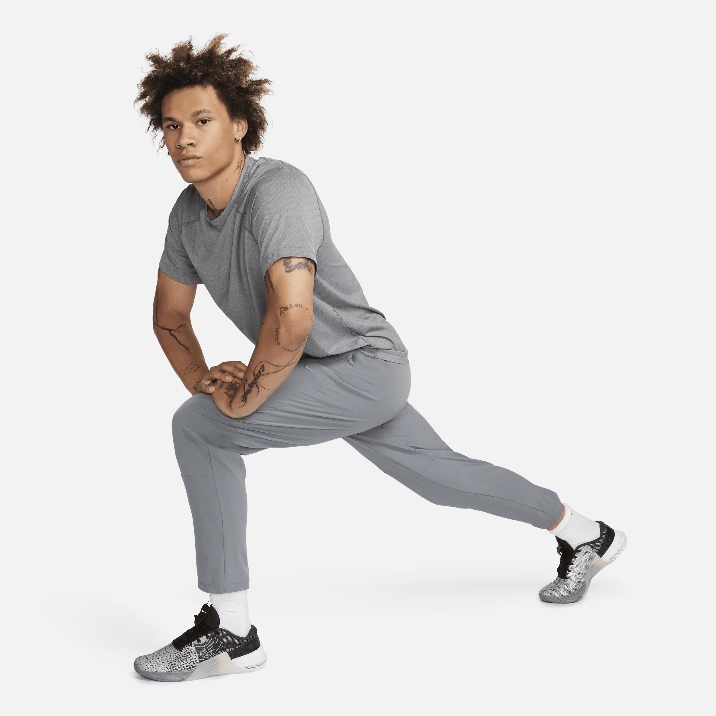 Nike Mens Unlimited Dri-FIT Tapered Leg Versatile Pants | FB7546-084 Product Image