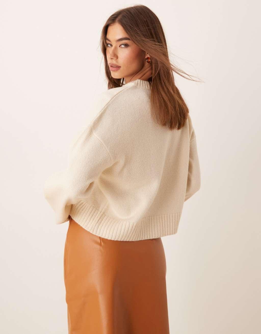 ASOS DESIGN knit crew neck cardigan with contrast black buttons in cream Product Image