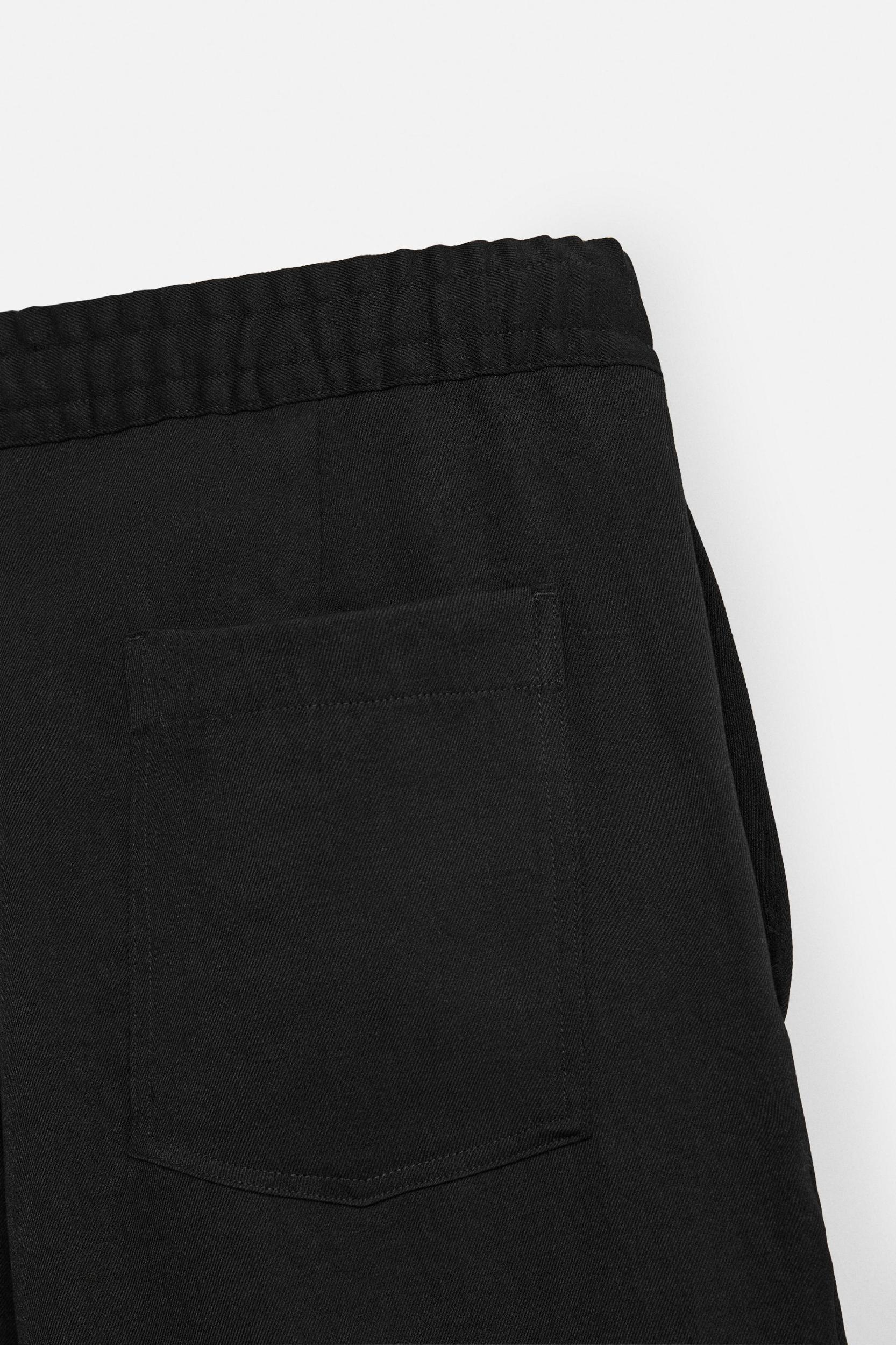 FLOWY PLEATED PANTS Product Image