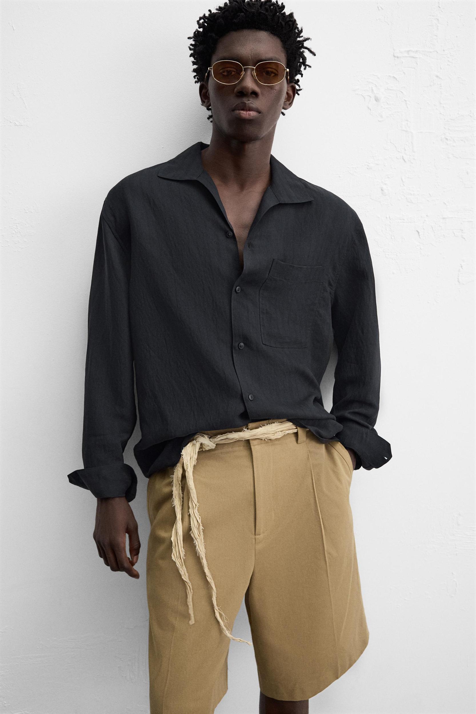 RELAXED FIT PLEATED SHORTS Product Image