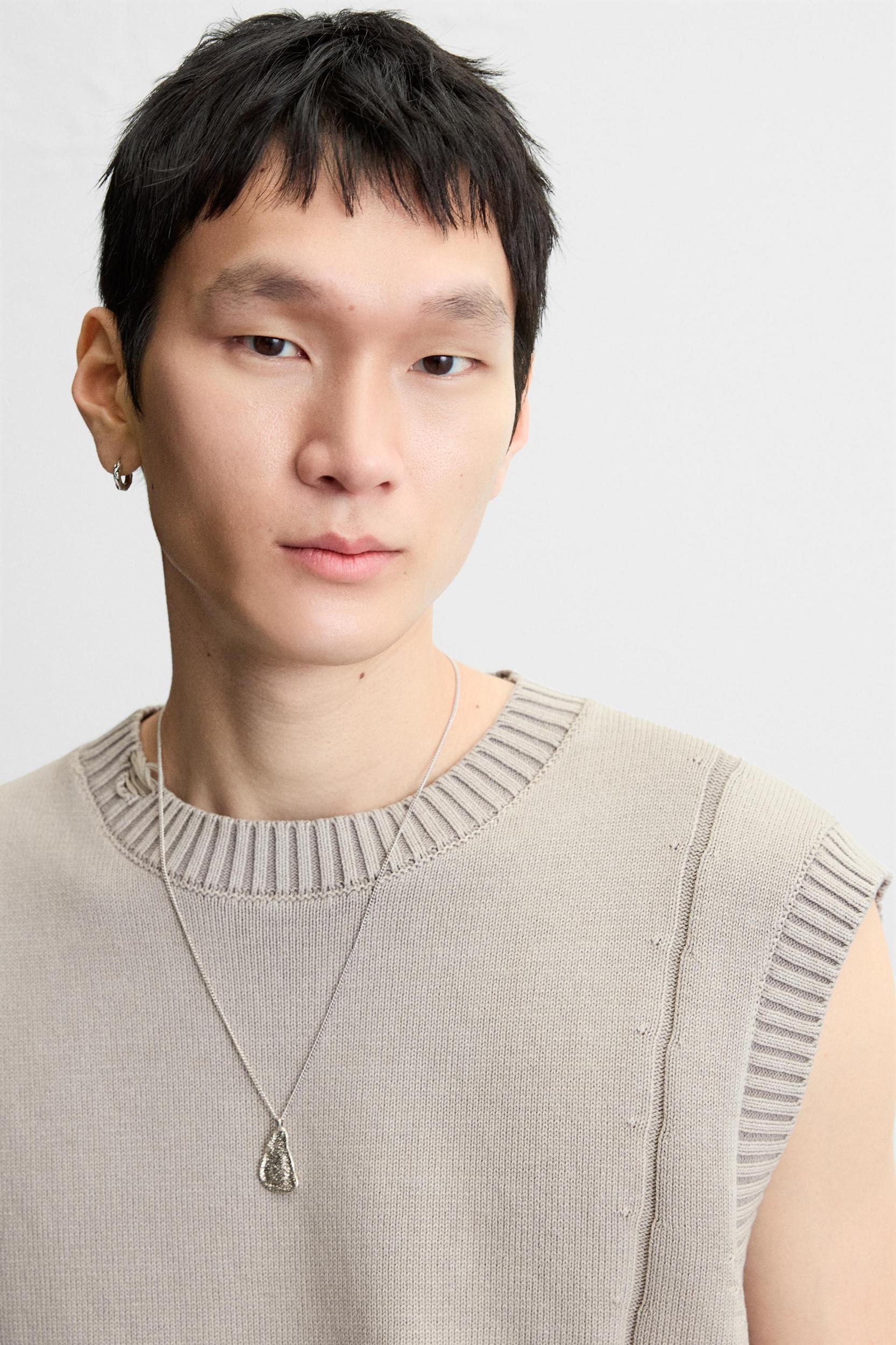 DISTRESSED KNIT VEST Product Image