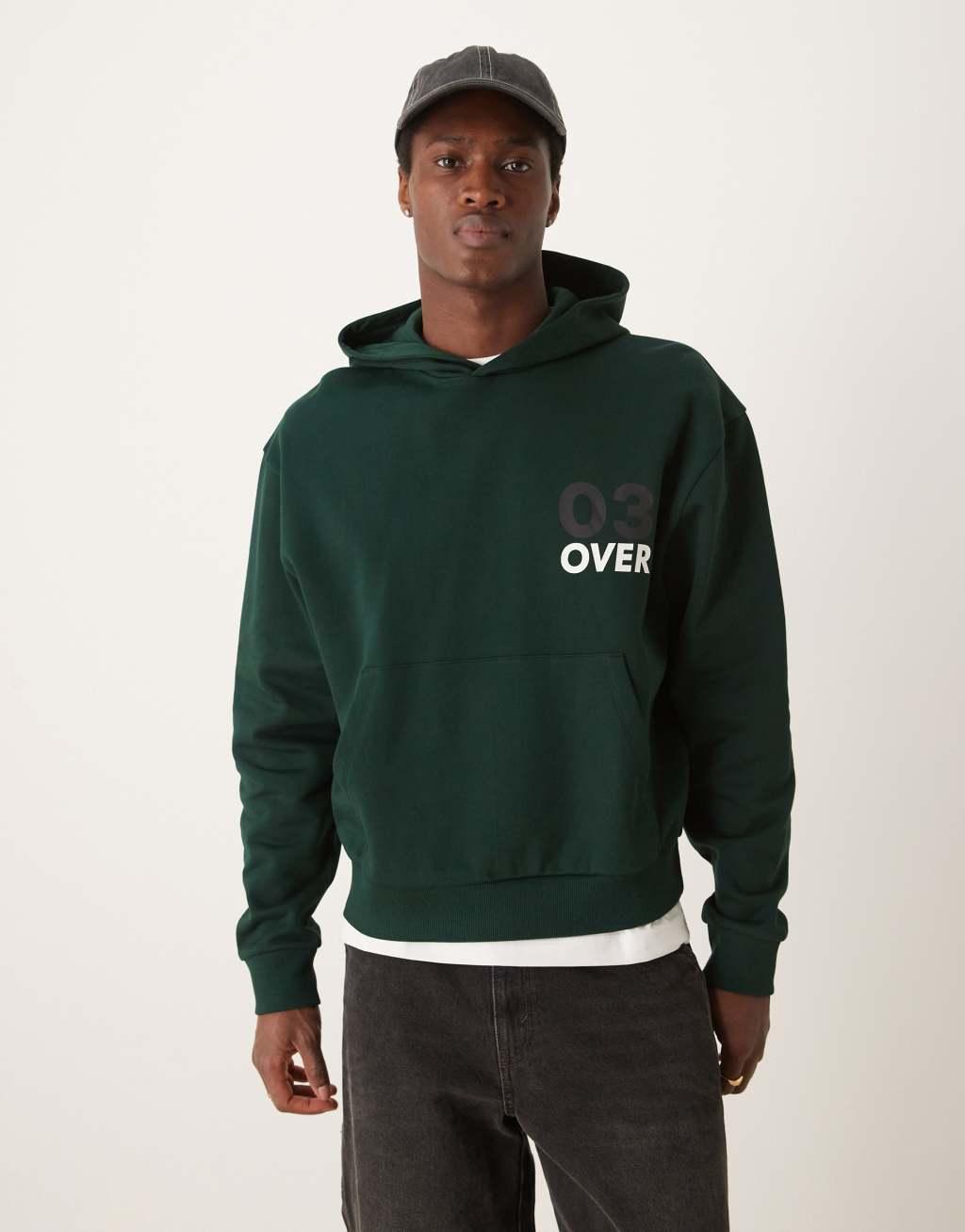 ASOS DESIGN boxy oversized hoodie with floral back print in dark green Product Image