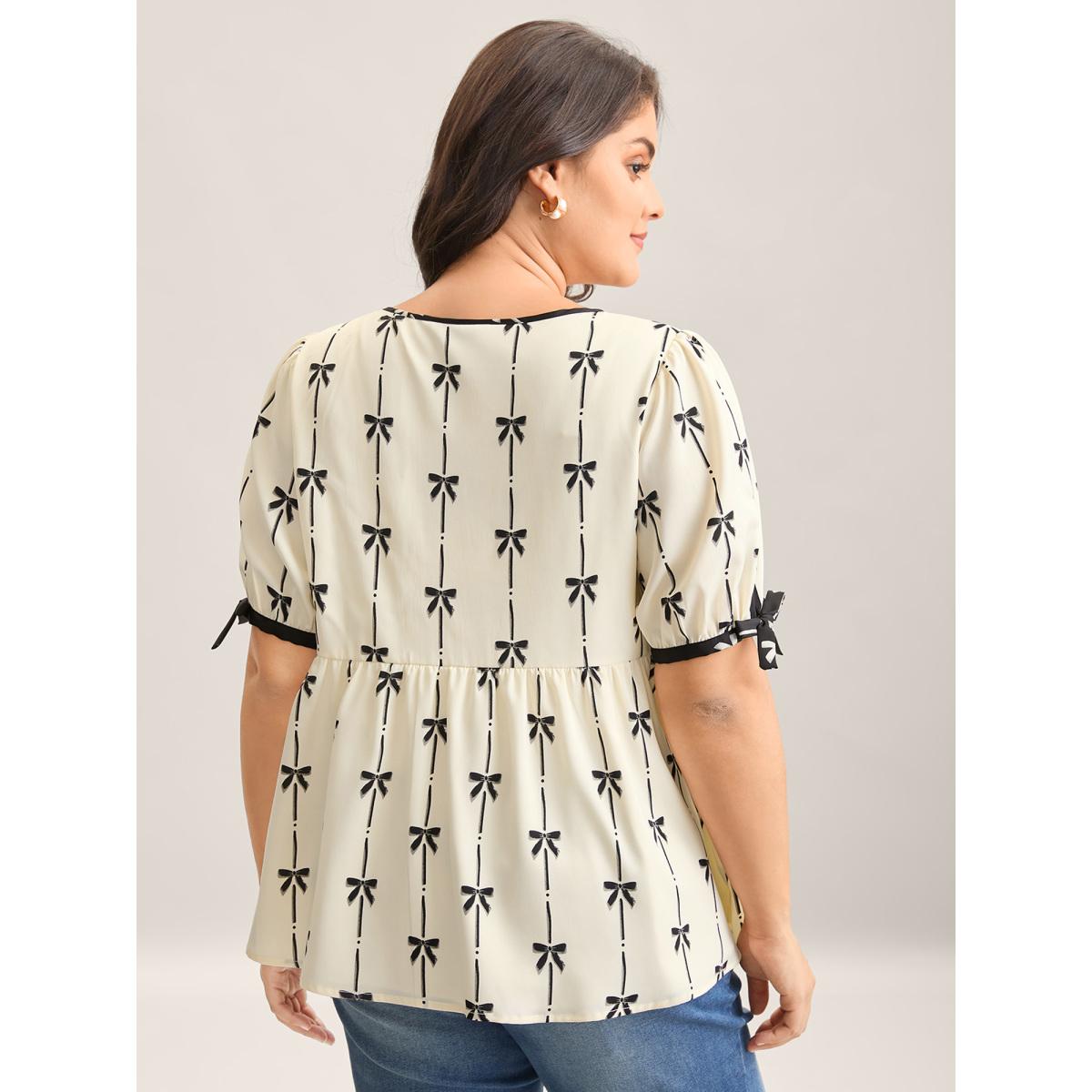 Plus Size Beige Bow Detail Printed Color Contrast Blouse Women Romantic Half Sleeve V-neck Elegant Blouses BloomChic 30/6X Product Image