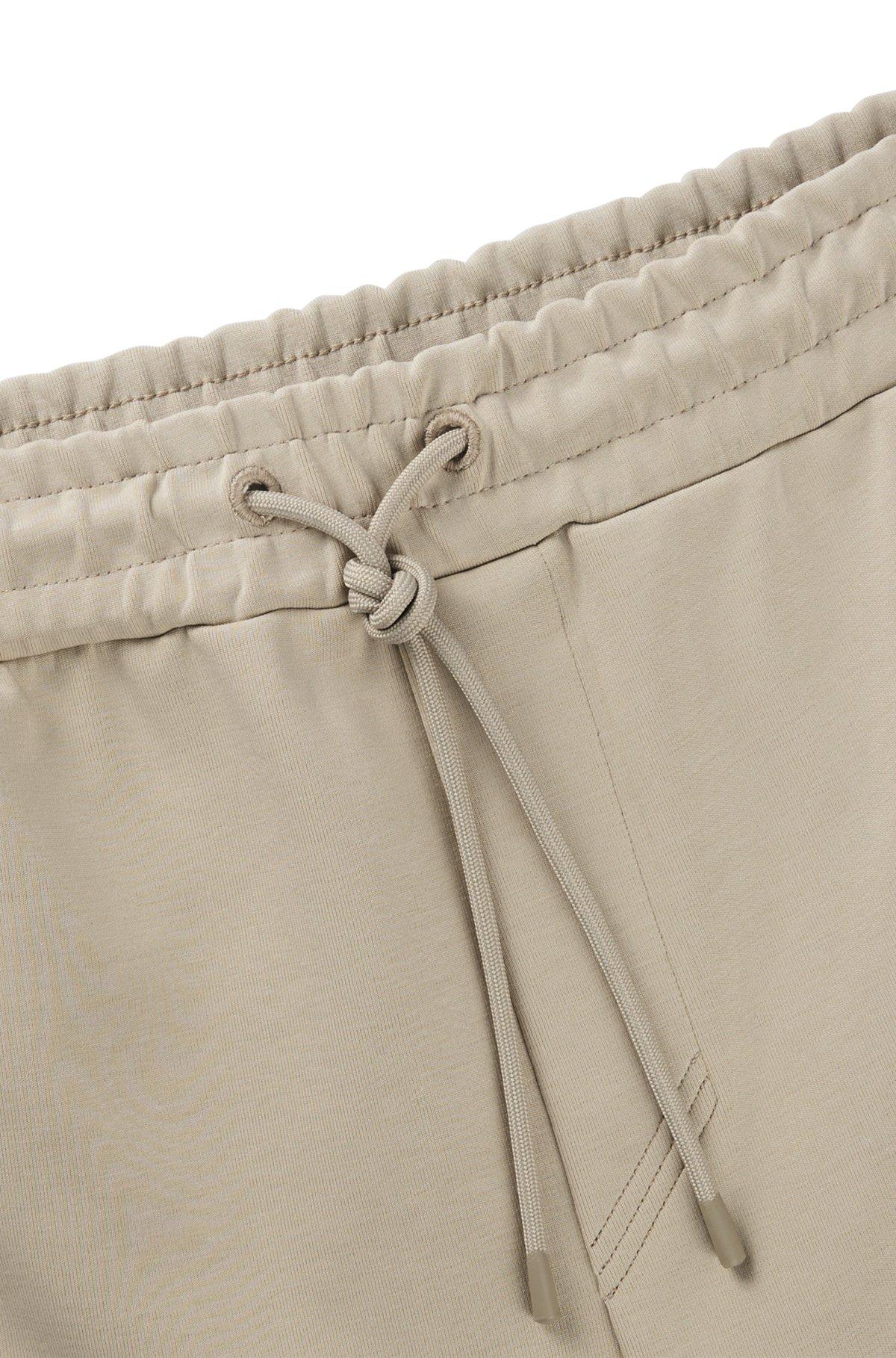 Tracksuit bottoms with tape inserts Product Image