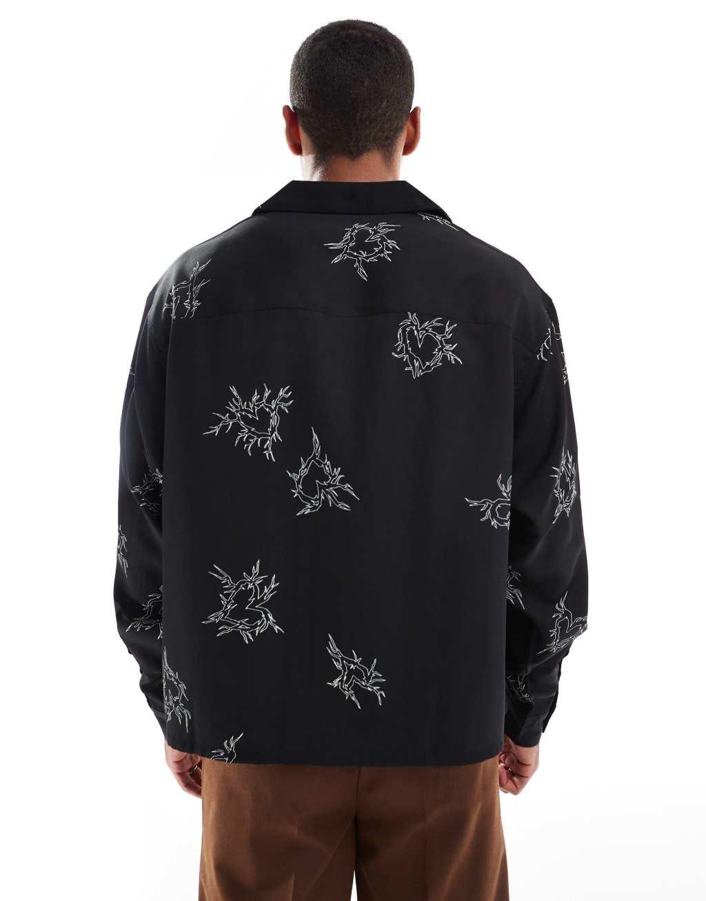 ASOS DESIGN boxy oversized deep revere shirt with heart print in black Product Image