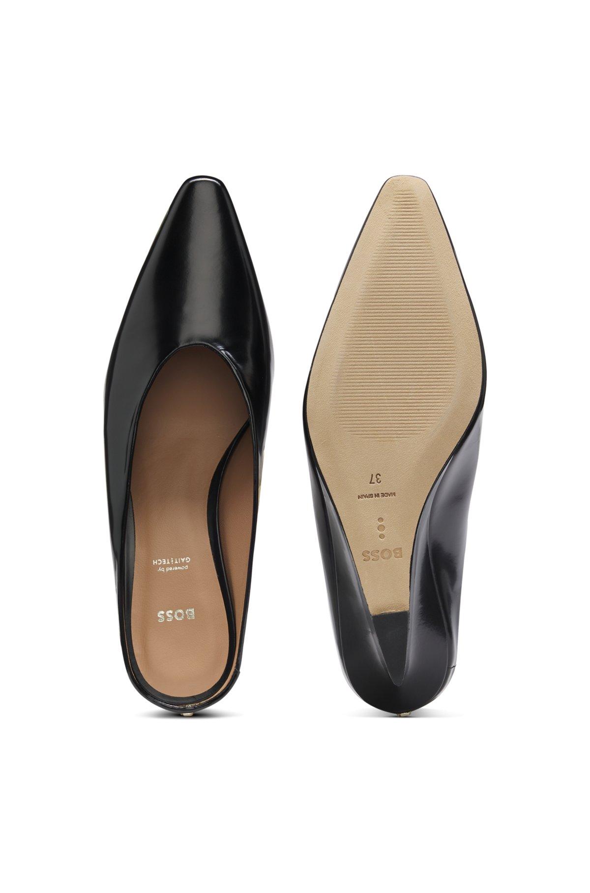 Wedge-heel mules in leather Product Image