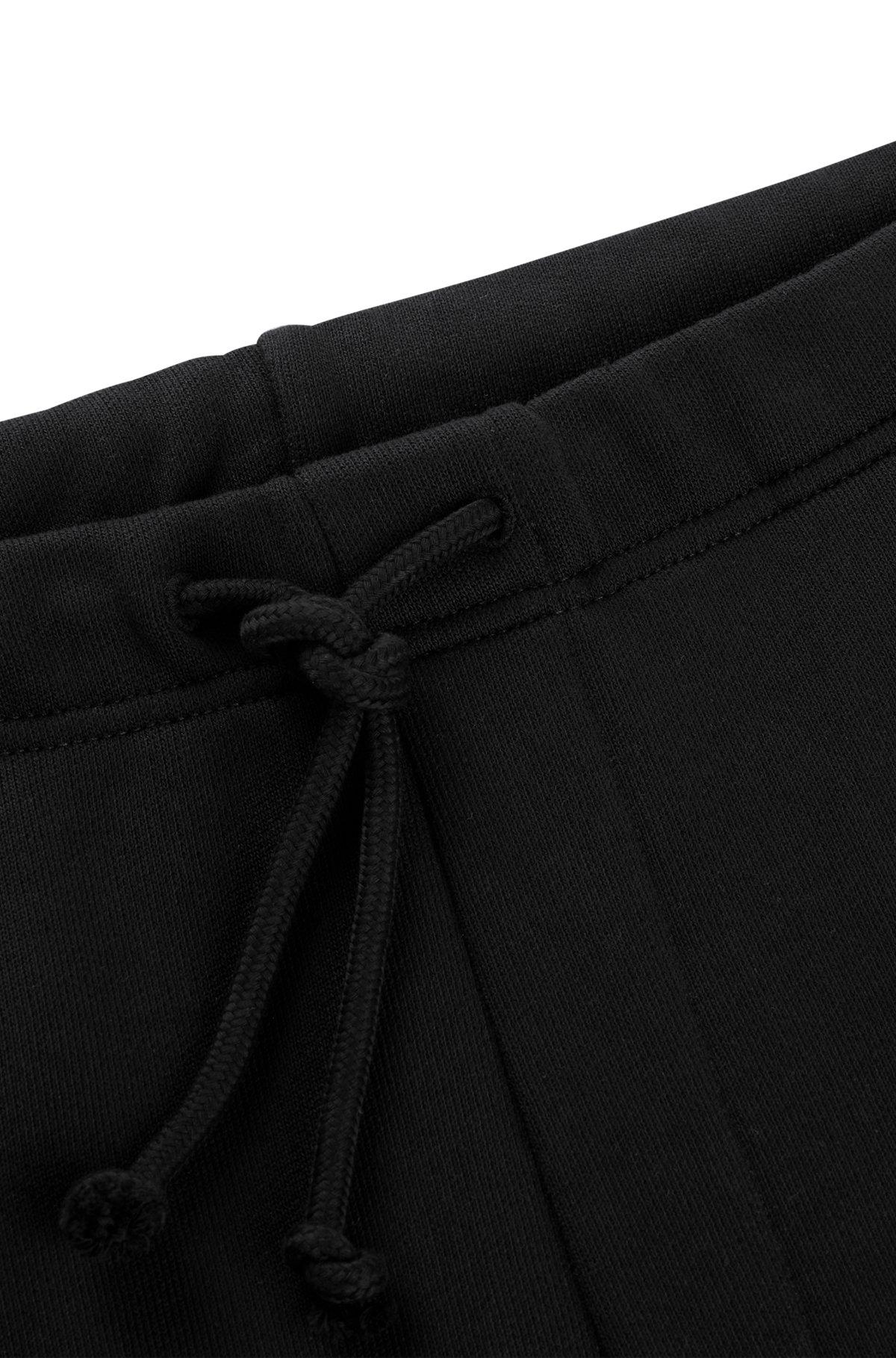 Relaxed-fit tracksuit bottoms with floral logo artwork Product Image