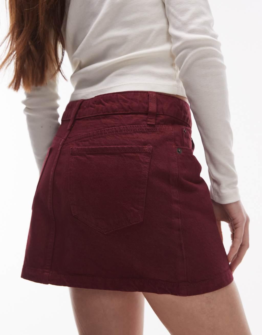 Topshop denim mini pelmet skirt in burgundy Product Image