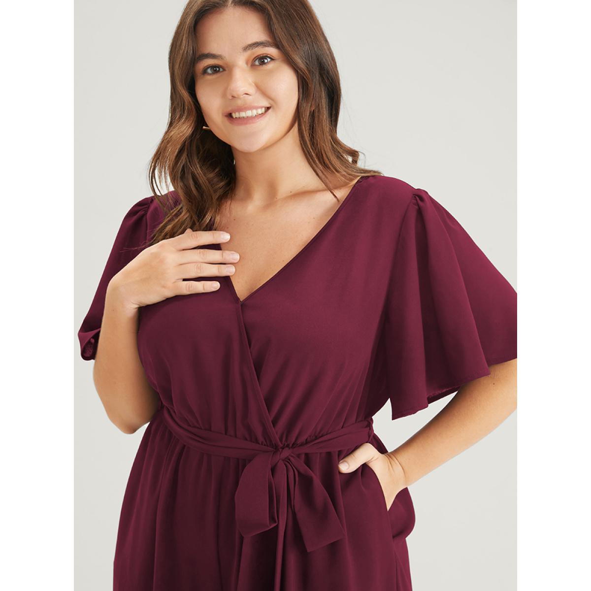 Plus Size Maroon Plain Scalloped Pocket Ruffles Button Belted Laser Cut Wrap Jumpsuit Women Elegant Short sleeve V-neck Dailywear Loose Jumpsuits BloomChic 30/6X Product Image