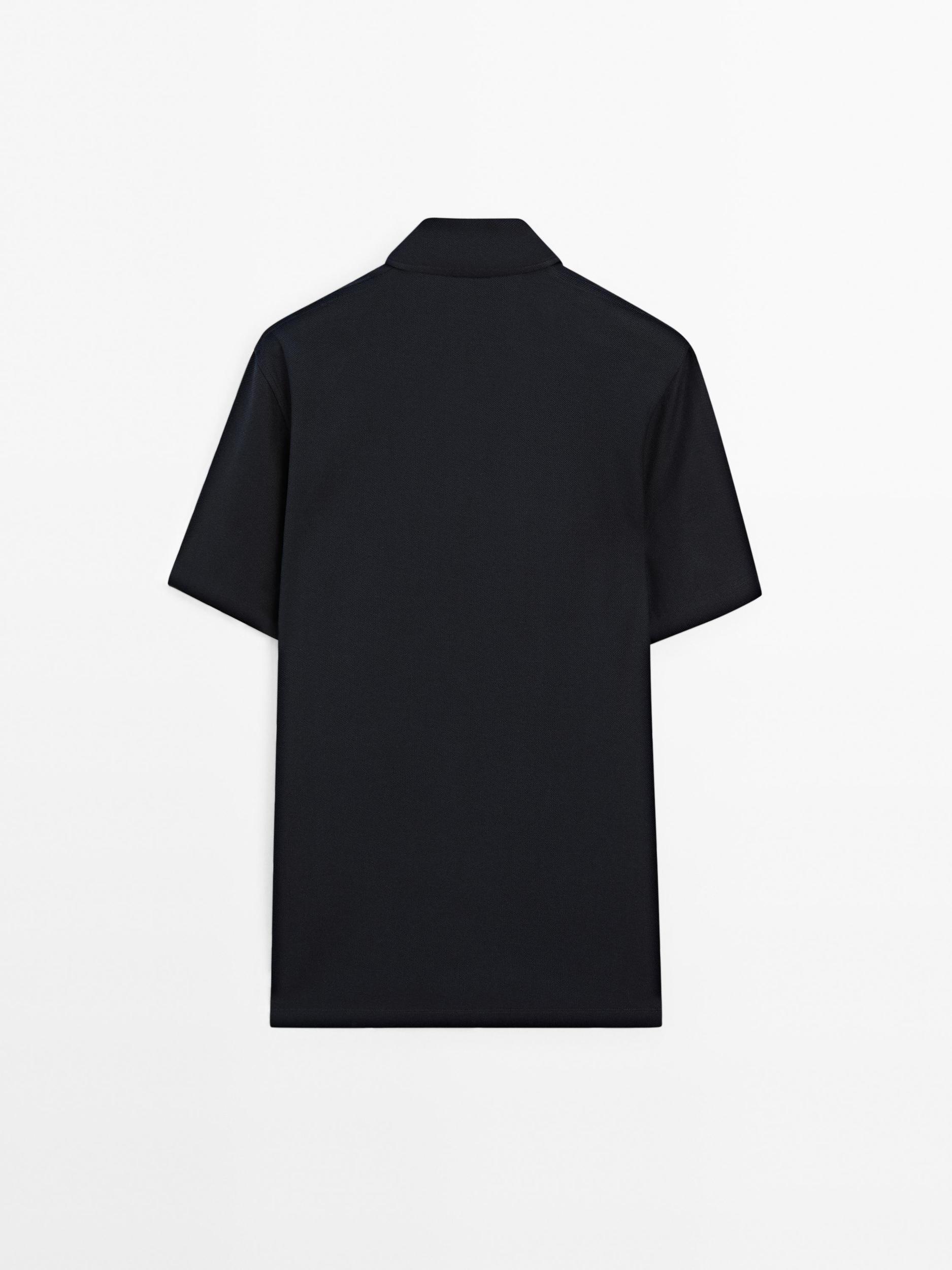 Textured polo shirt with hidden button Product Image