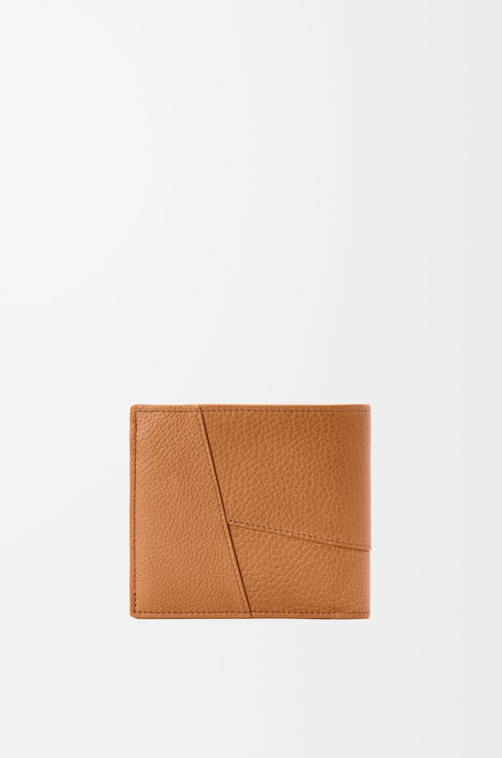 Puzzle bifold wallet in supple grained calfskin Product Image