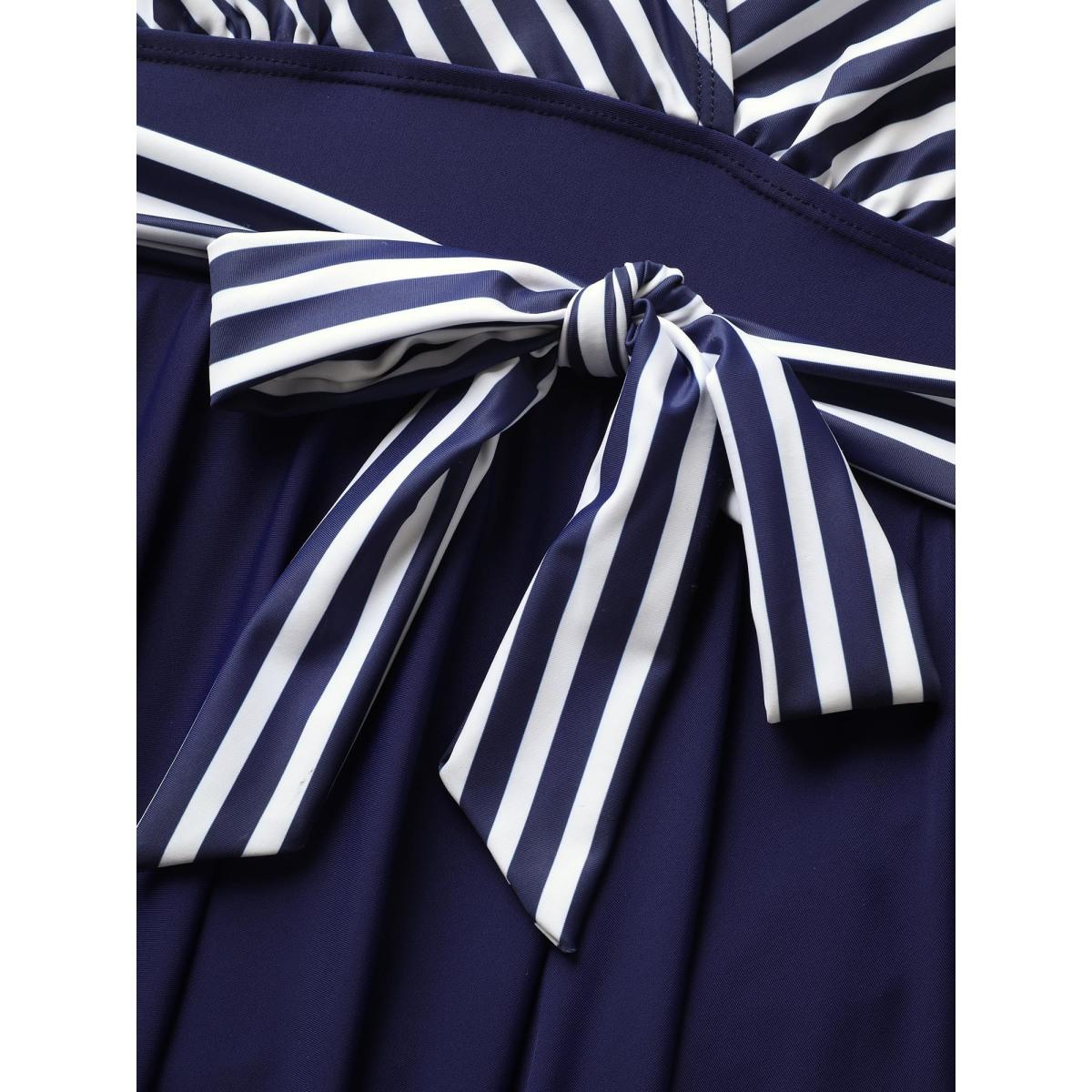 Plus Size Striped Patchwork Wrap Tie Knot Swim Dress Women's Swimwear Indigo Beach Bodycon Overlap Collar High stretch Curve Swim Dresses BloomChic 10/M Product Image