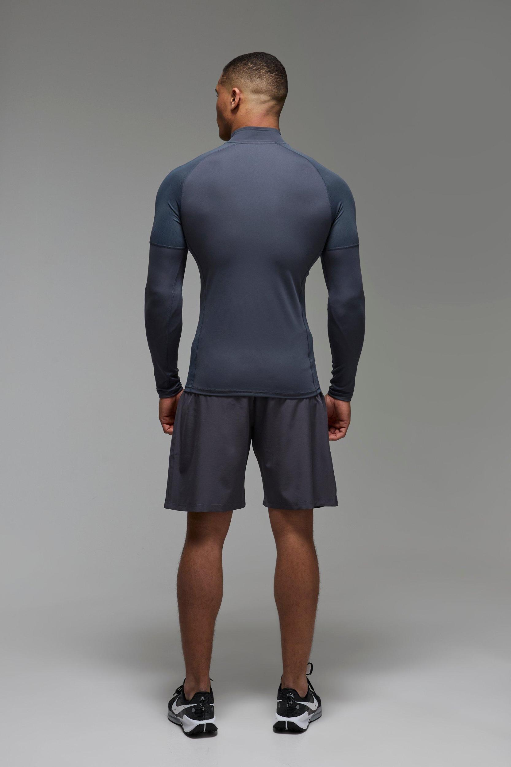 Man Active Muscle Fit Grid Panel Performance 1/4 Zip | boohooMAN USA Product Image