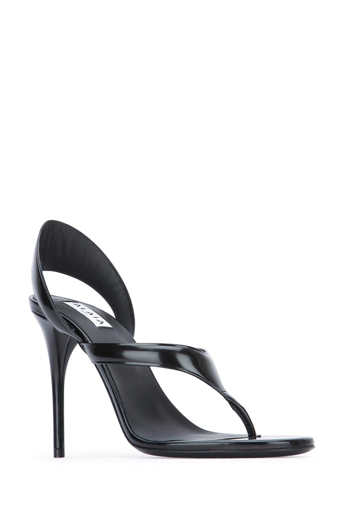 ALAÏA Leather Thong Slingback Sandals In Noir Product Image