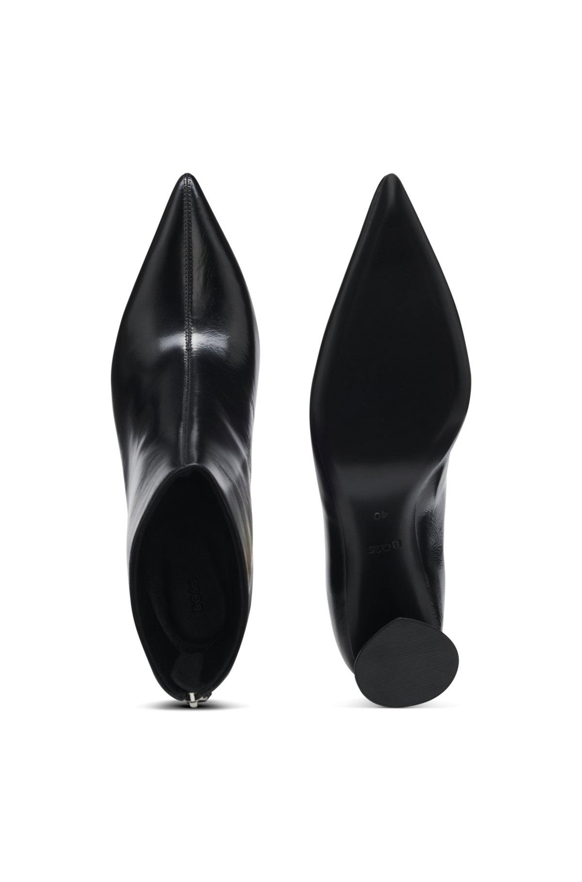 Ankle boots in leather with embossed logo Product Image