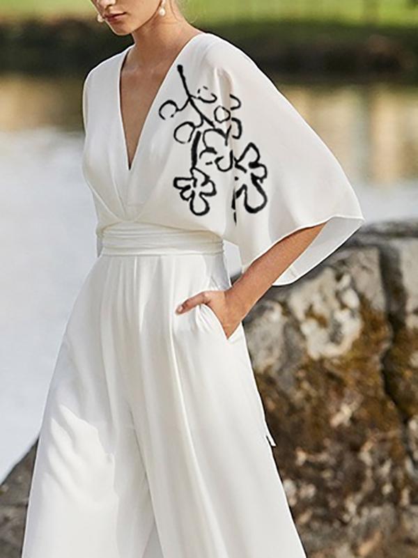 Half Sleeves High Waisted Flower Print Pleated Pockets Deep V-Neck Jumpsuits Product Image