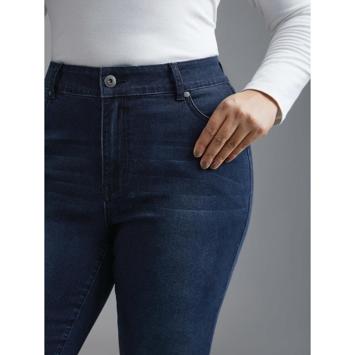 Plus Size Booty-Lifting Skinny Fit Mid-Rise Jeans Women Denimindigo Elegant Button Medium stretch Slanted pocket Jeans BloomChic 22/3X Product Image