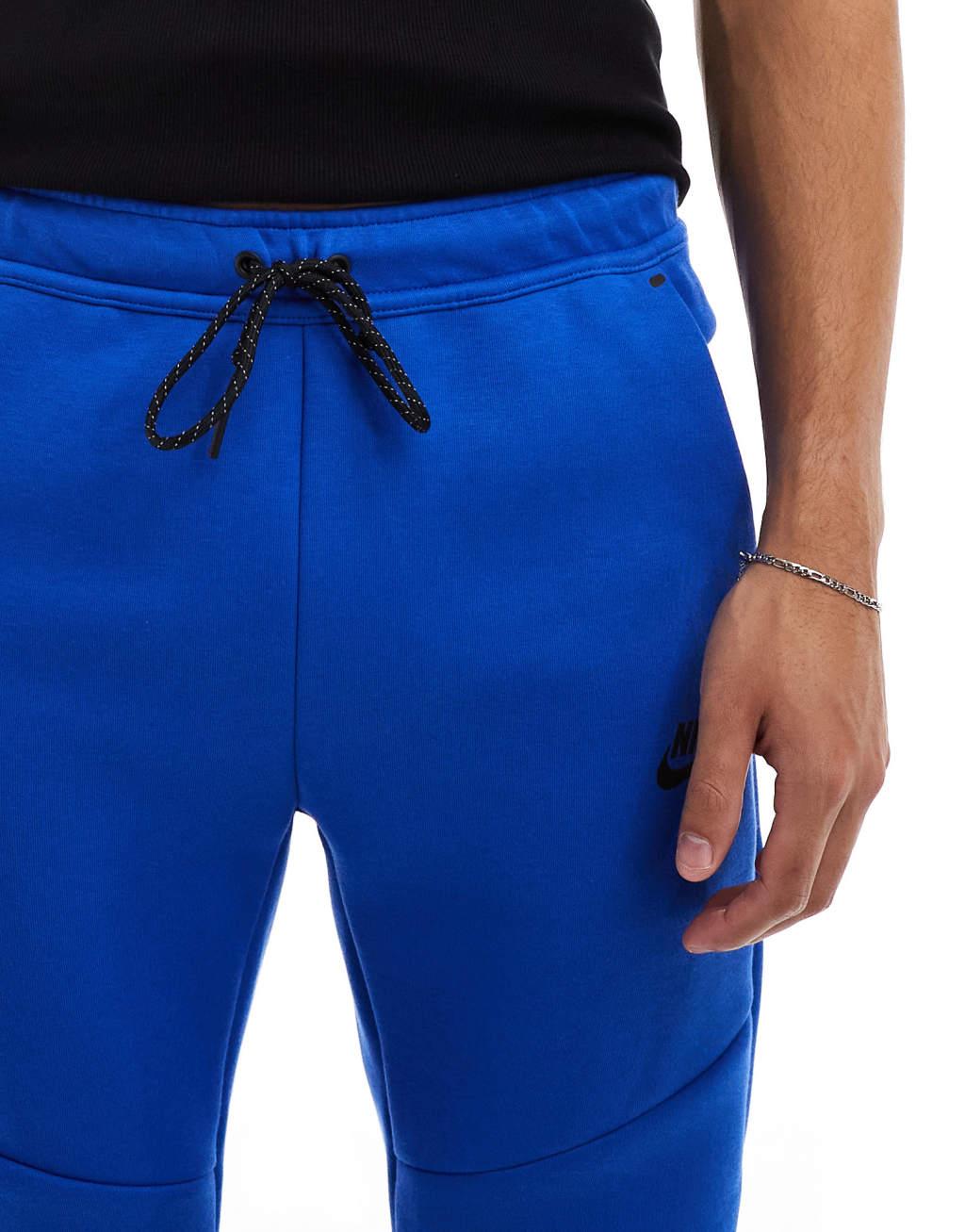 Nike Tech Fleece cuffed sweatpants in blue Product Image