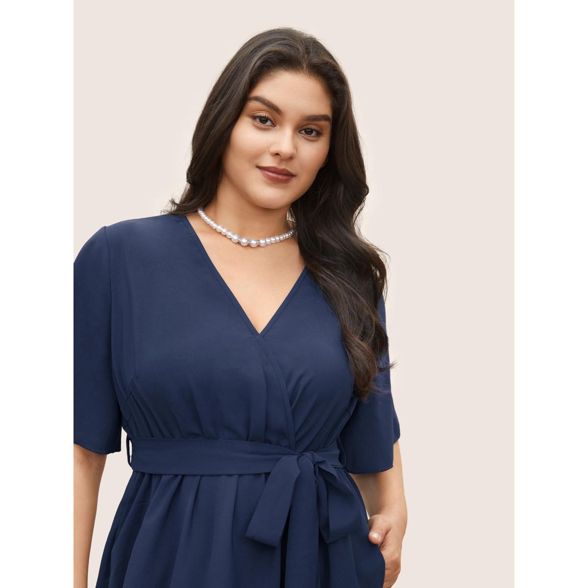 Plus Size Bloom Dress - Solid Tie Surplice Ruffle High Low Dress DarkBlue Women Elegant Cross straps V-neck Short sleeve Curvy Midi Dress BloomChic 22-24/3X Product Image