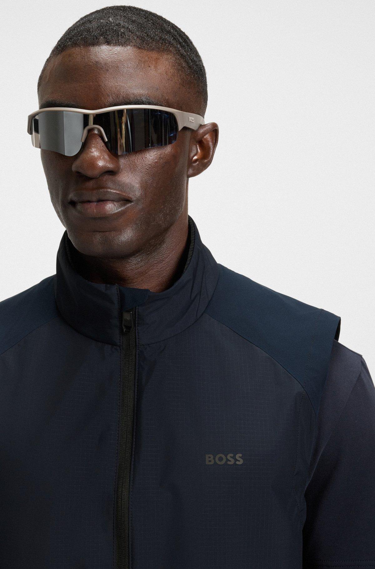 Water-repellent golf vest with decorative reflective details Product Image