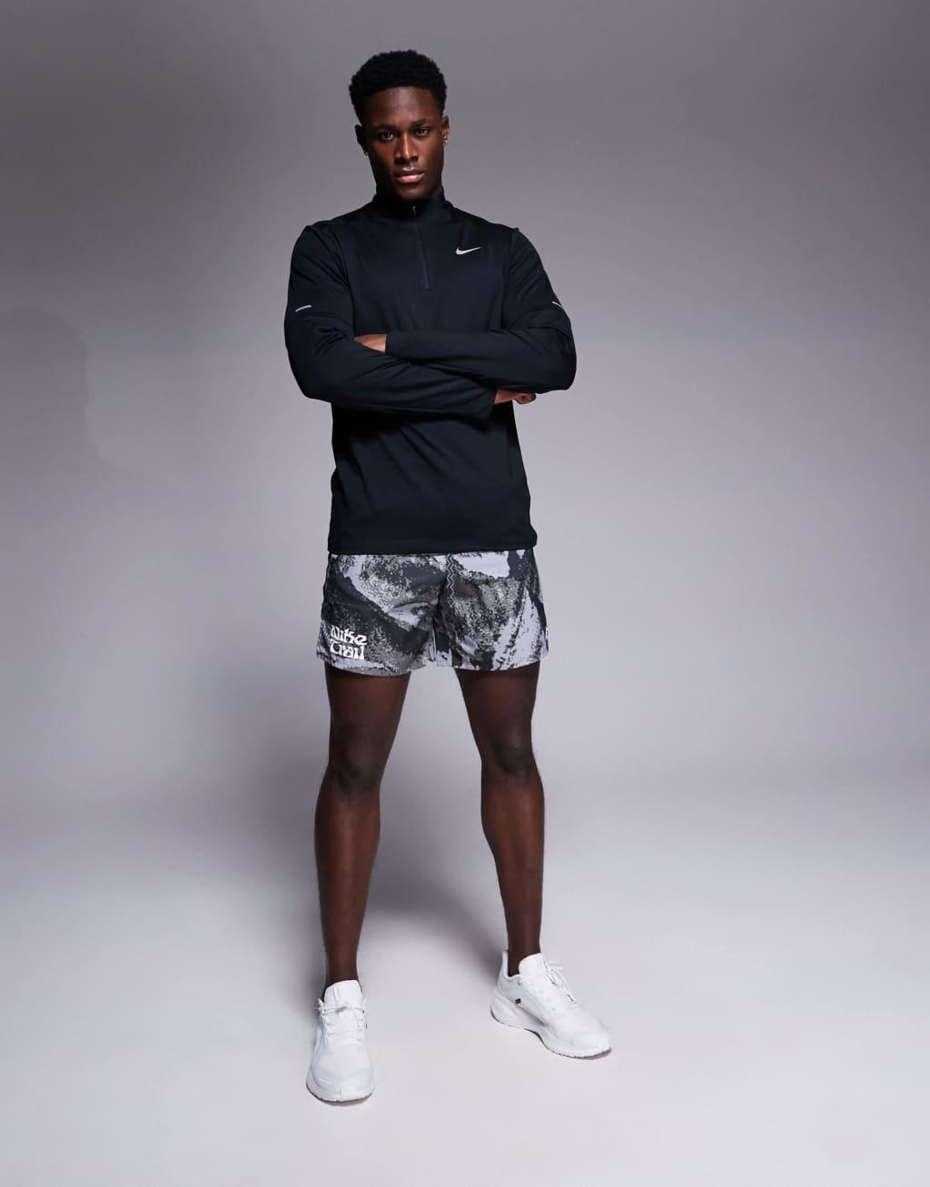 Nike Running DRI-FIT Element half zip sweatshirt in black  Product Image