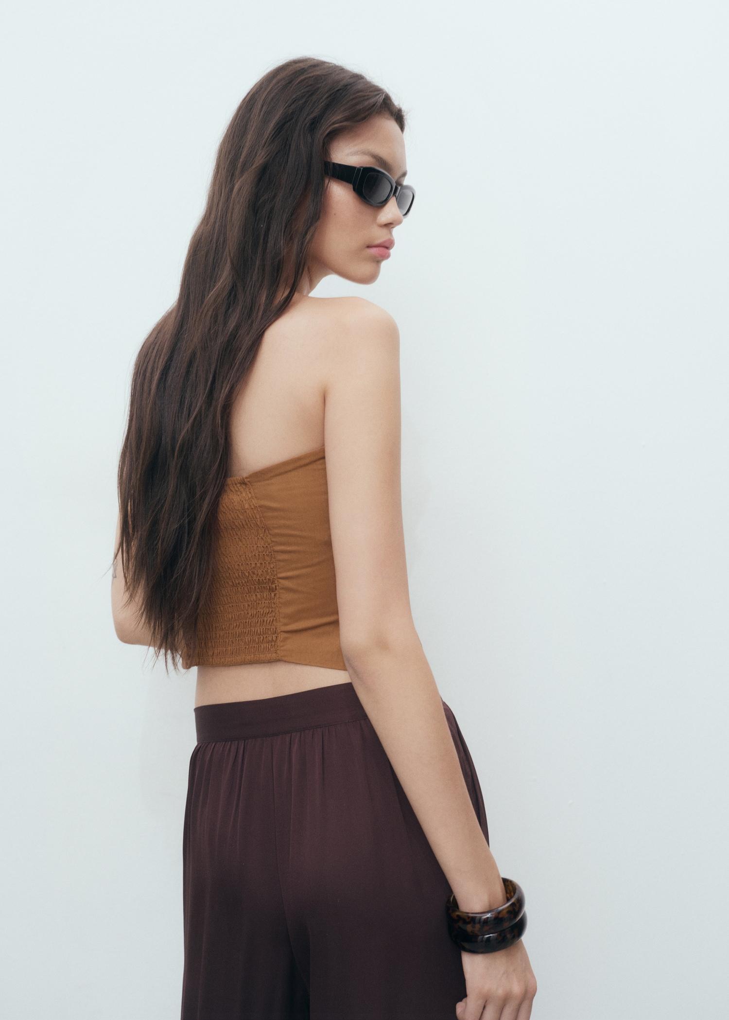 Asymmetrical strapless top - Women | MANGO USA Product Image
