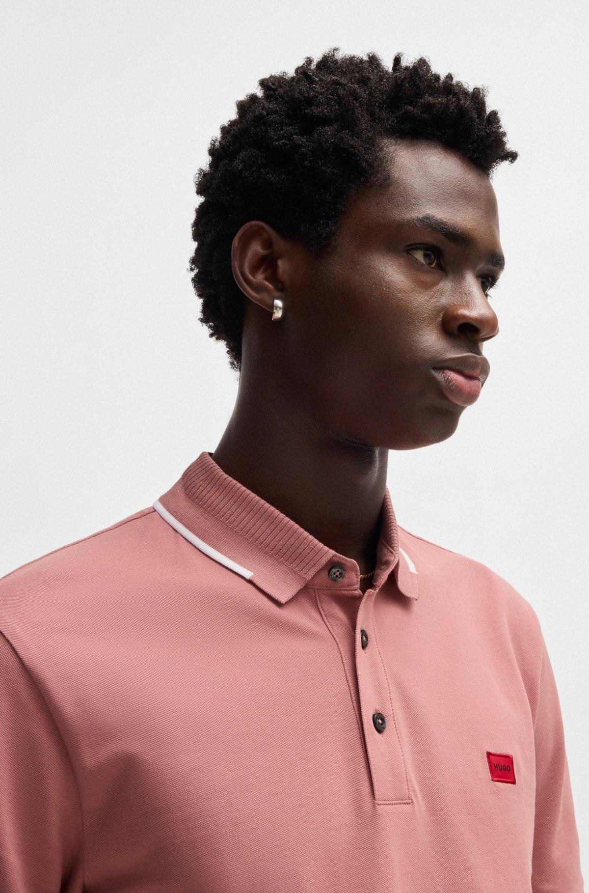 Slim-fit polo shirt with red logo label Product Image