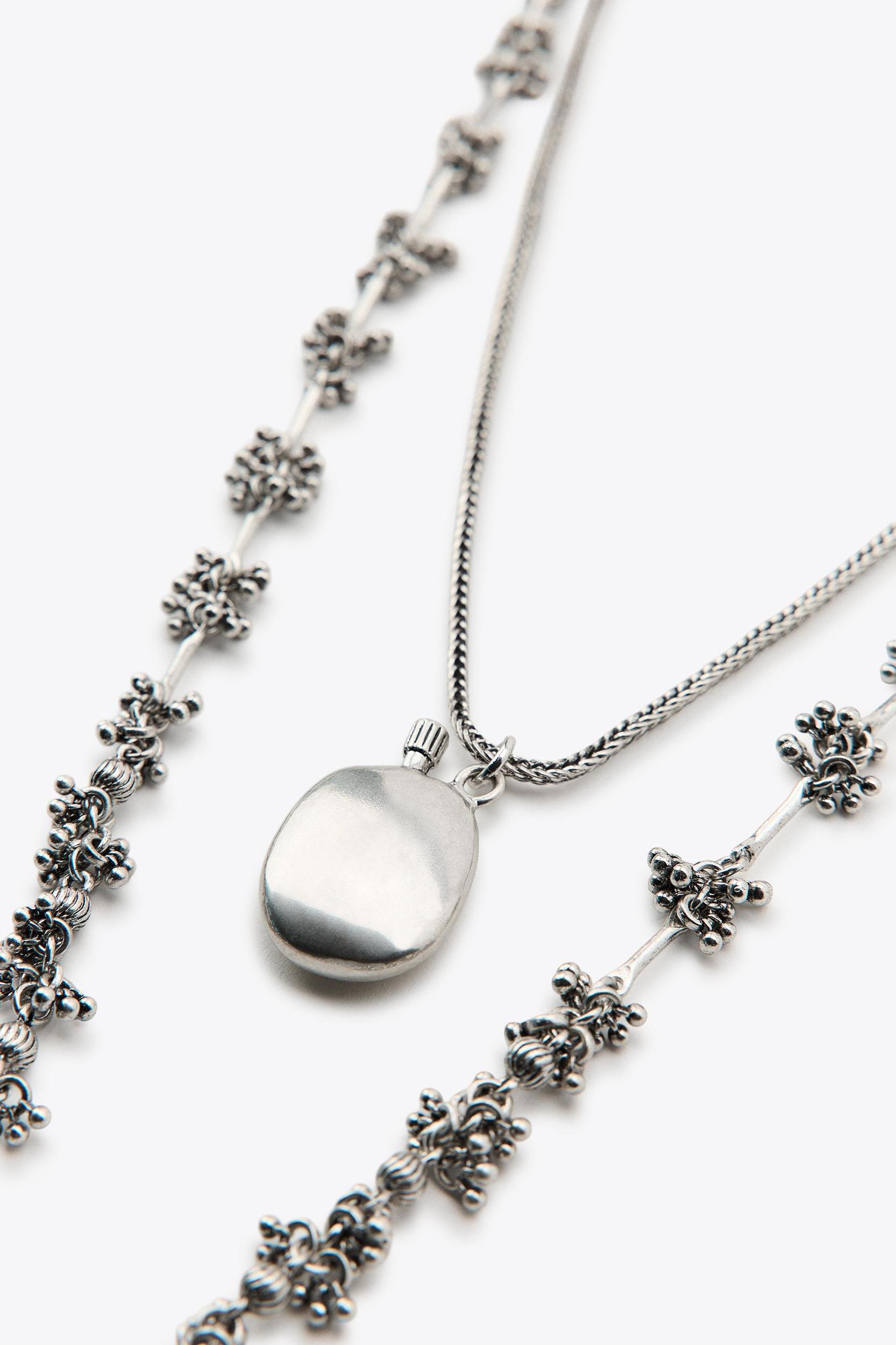 2-PACK NECKLACES WITH PIECES AND BOTTLE Product Image