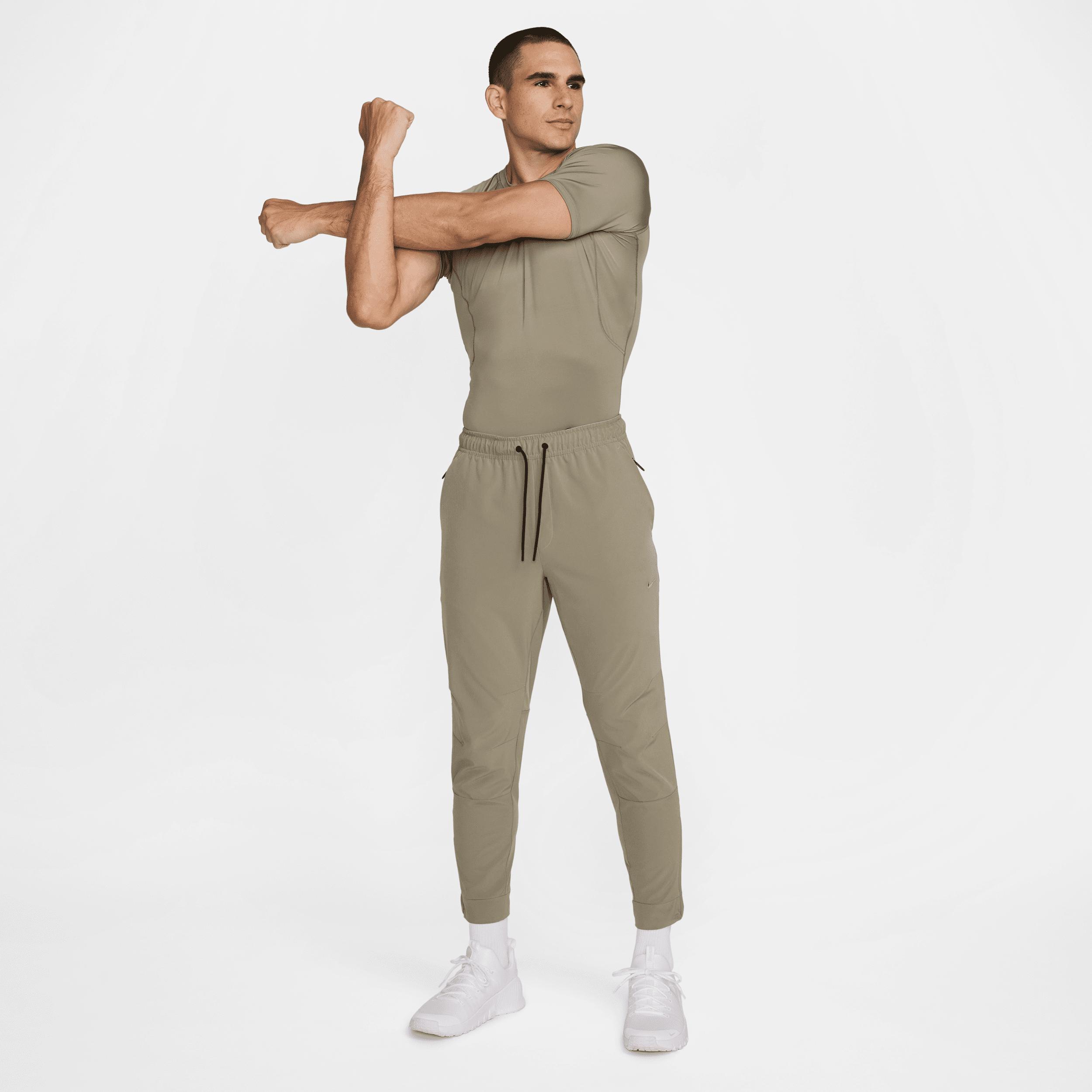 Nike Mens Unlimited Dri-FIT Zippered Cuff Versatile Pants | FB7548-320 Product Image