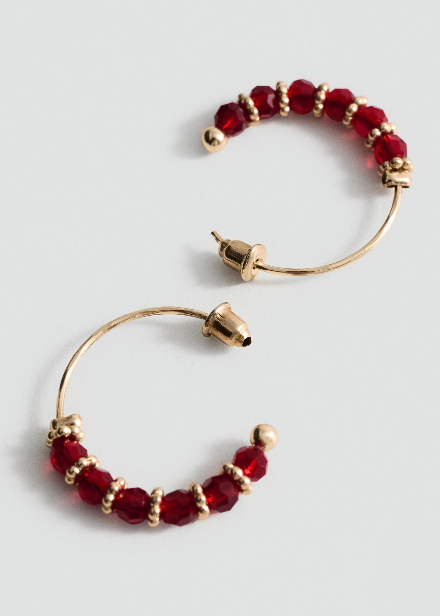 Hoop earrings with ball appliqué - Women | MANGO USA Product Image