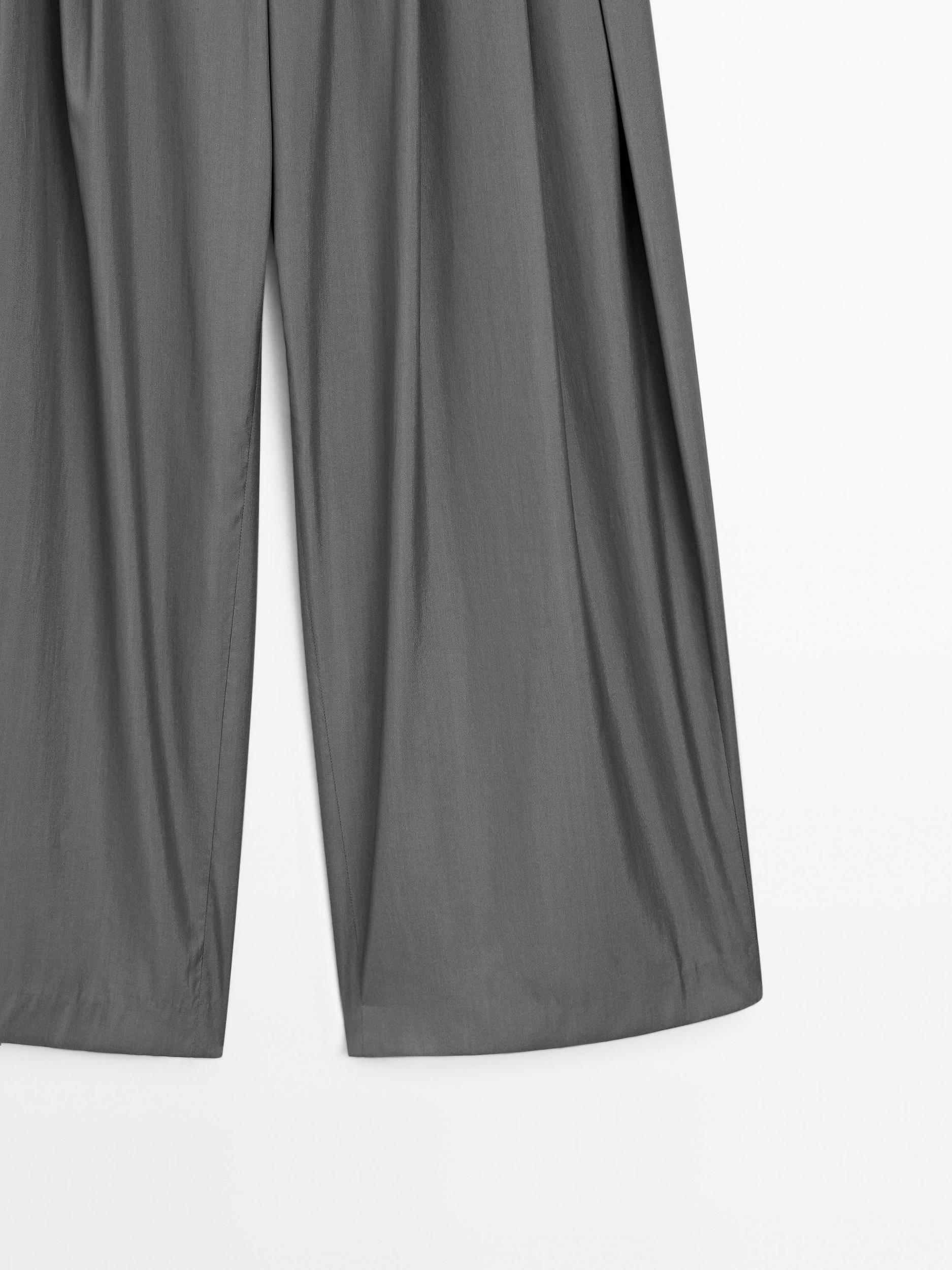 Flowing trousers with darts Product Image