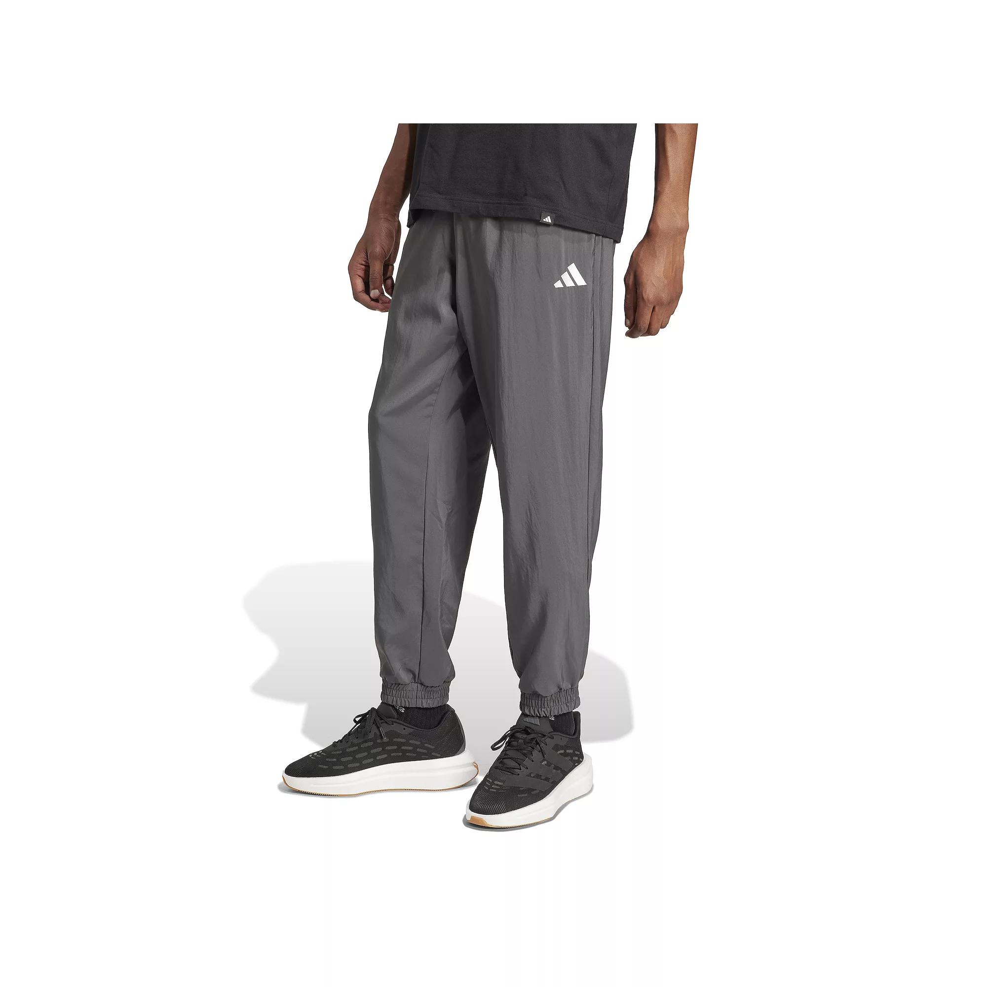 Men's adidas Essentials Small Logo Stanford Sportswear Woven Track Pants,  Product Image