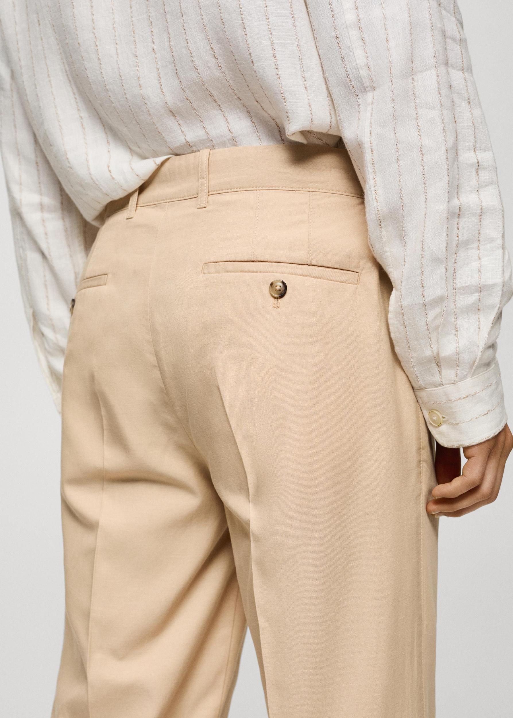 Cotton lyocell pleated pants - Men | MANGO USA Product Image