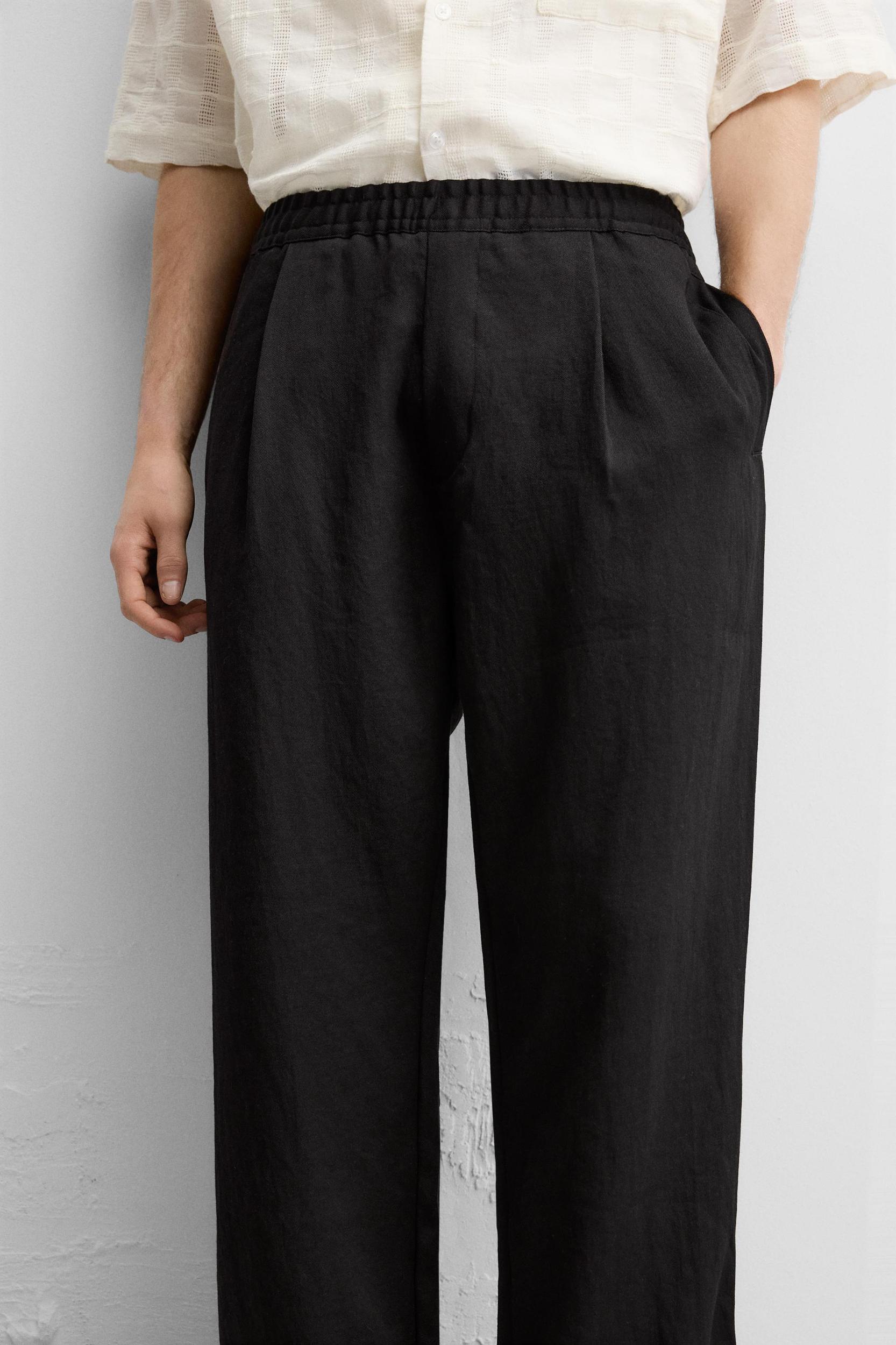 FLOWY PLEATED PANTS Product Image