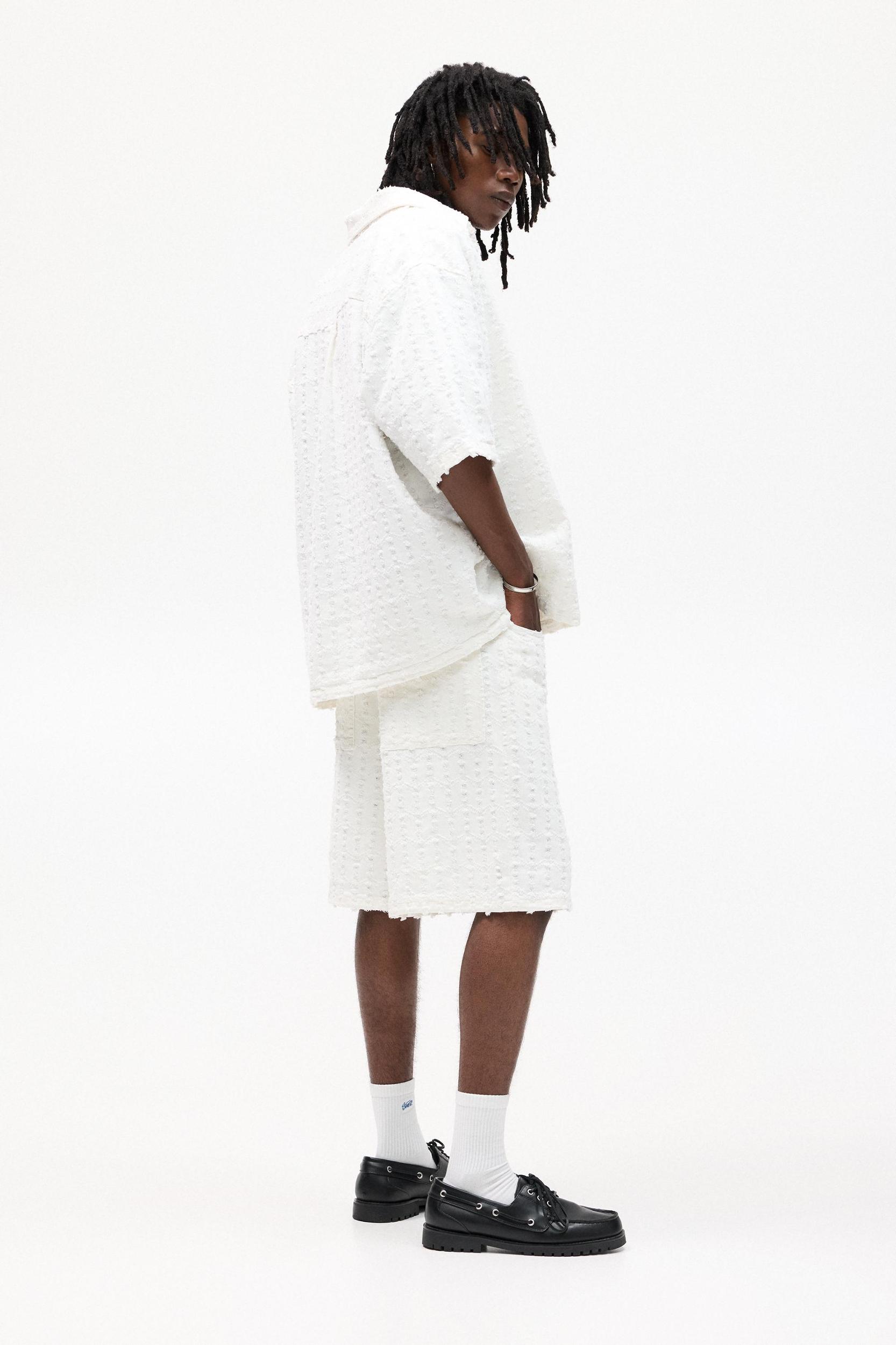 Textured baggy denim Bermuda shorts Product Image