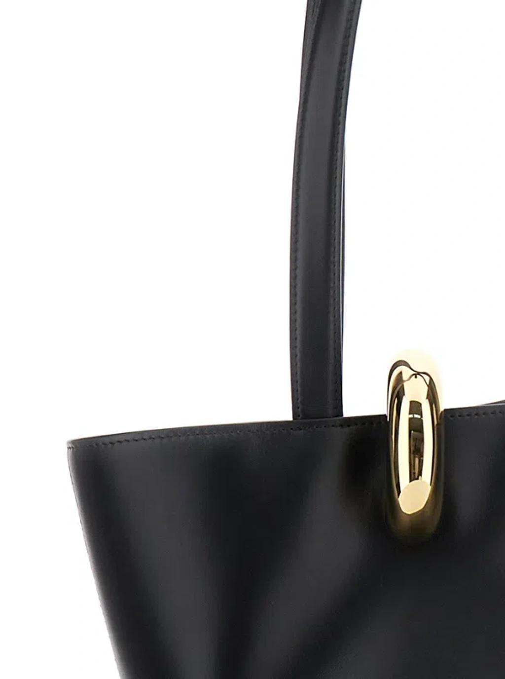 JACQUEMUS The Medium Bambola Asymmetric Leather Bucket Bag In Black 990 Product Image