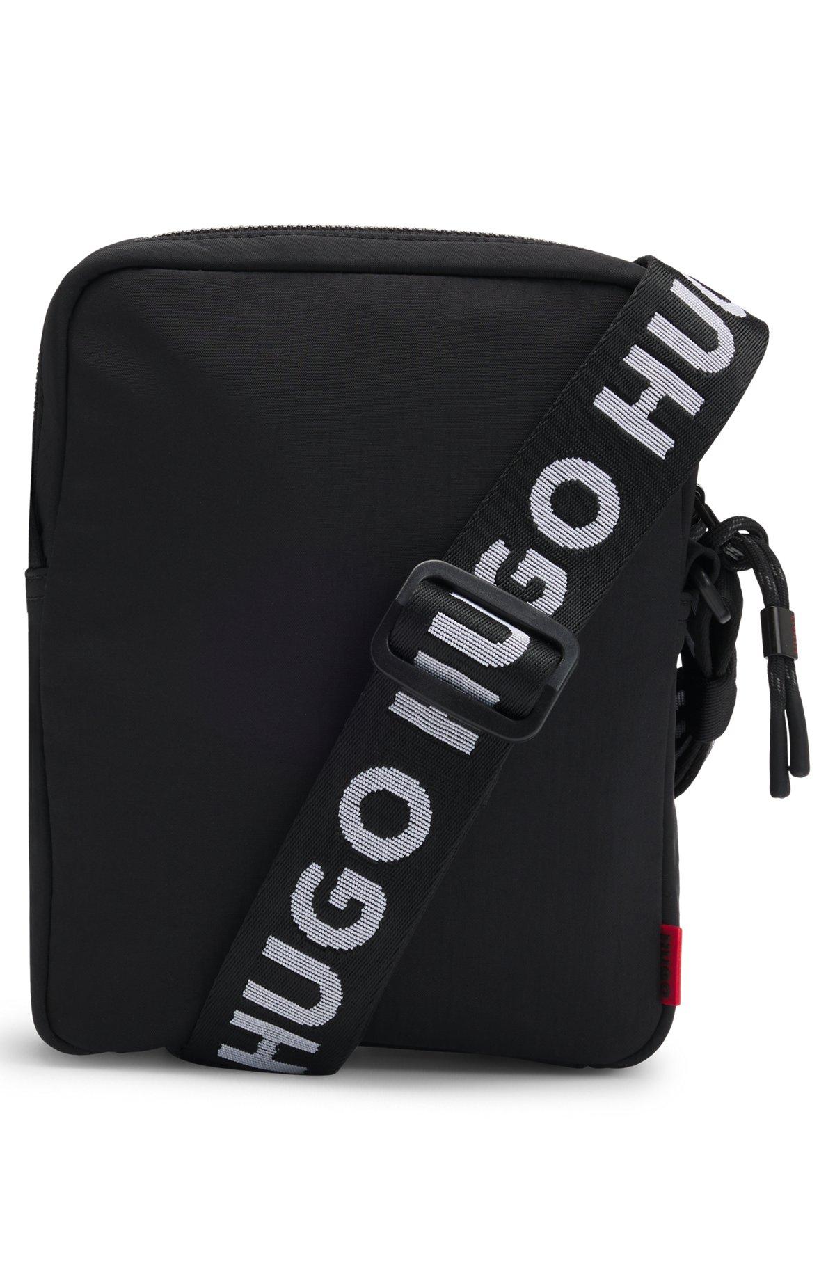 Reporter bag with branded adjustable strap and zip closure Product Image
