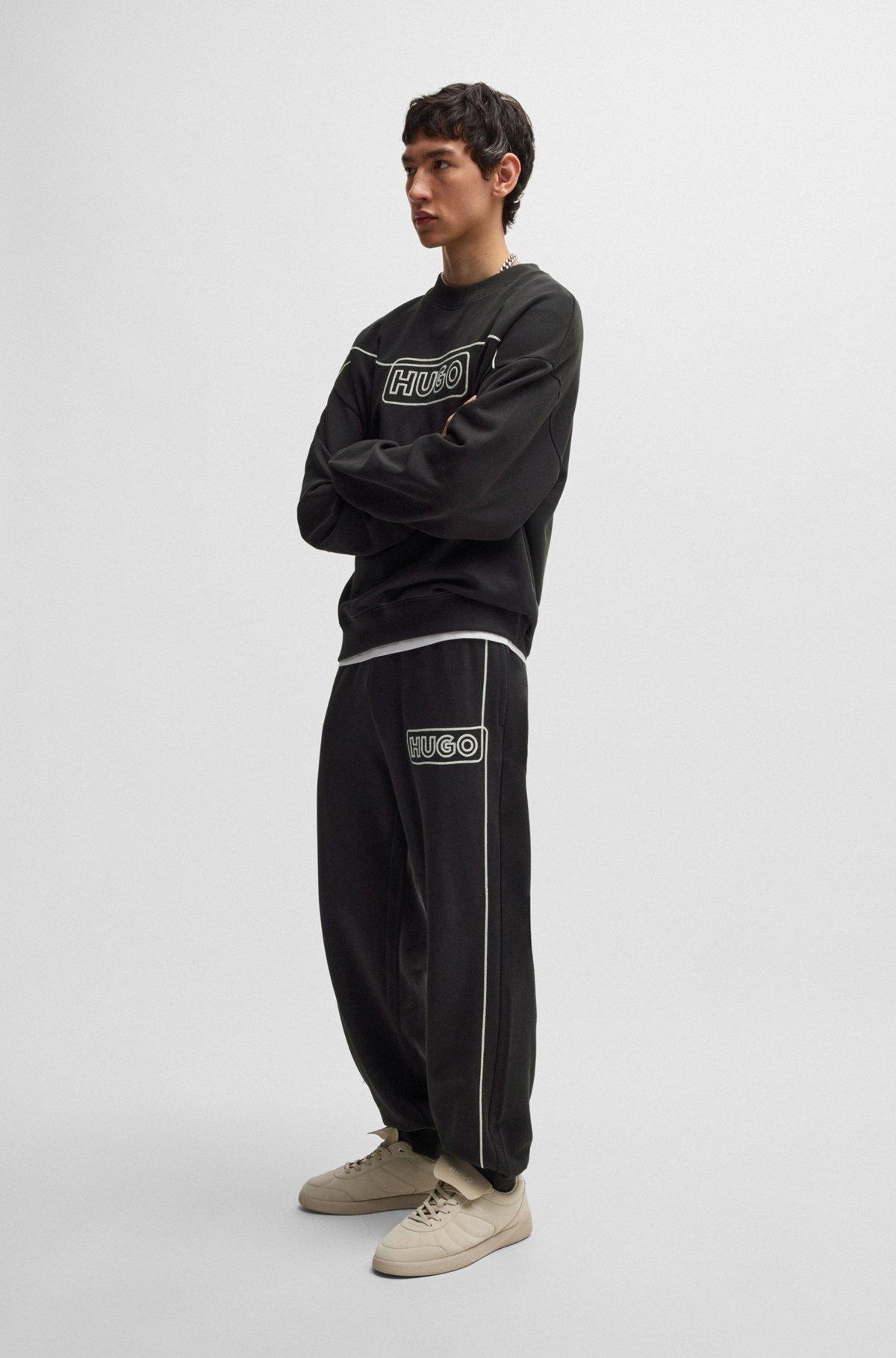 Cotton-terry tracksuit bottoms with chain-stitch logo Product Image