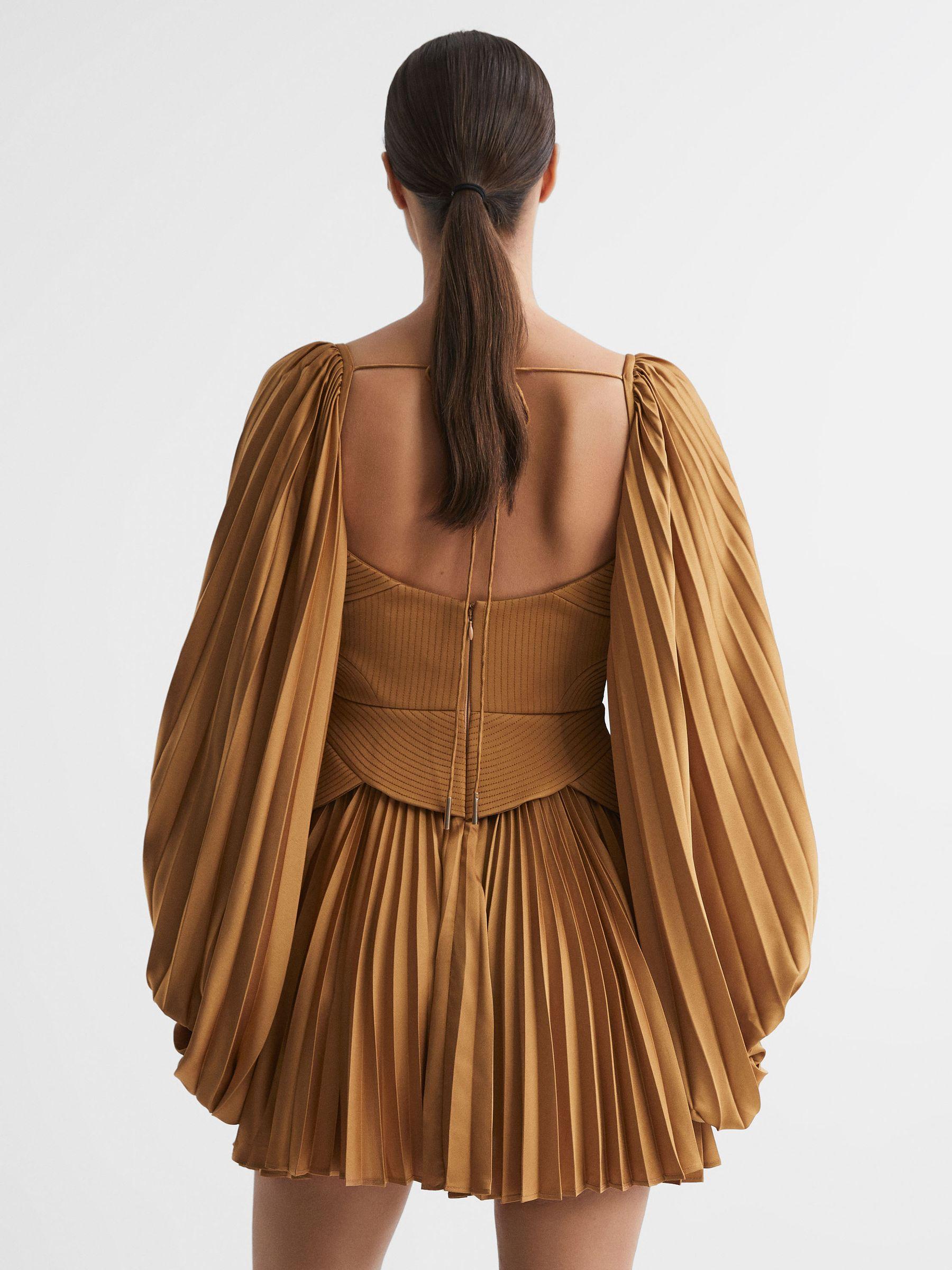Acler Peplum Pleated Mini Dress in Gold Product Image