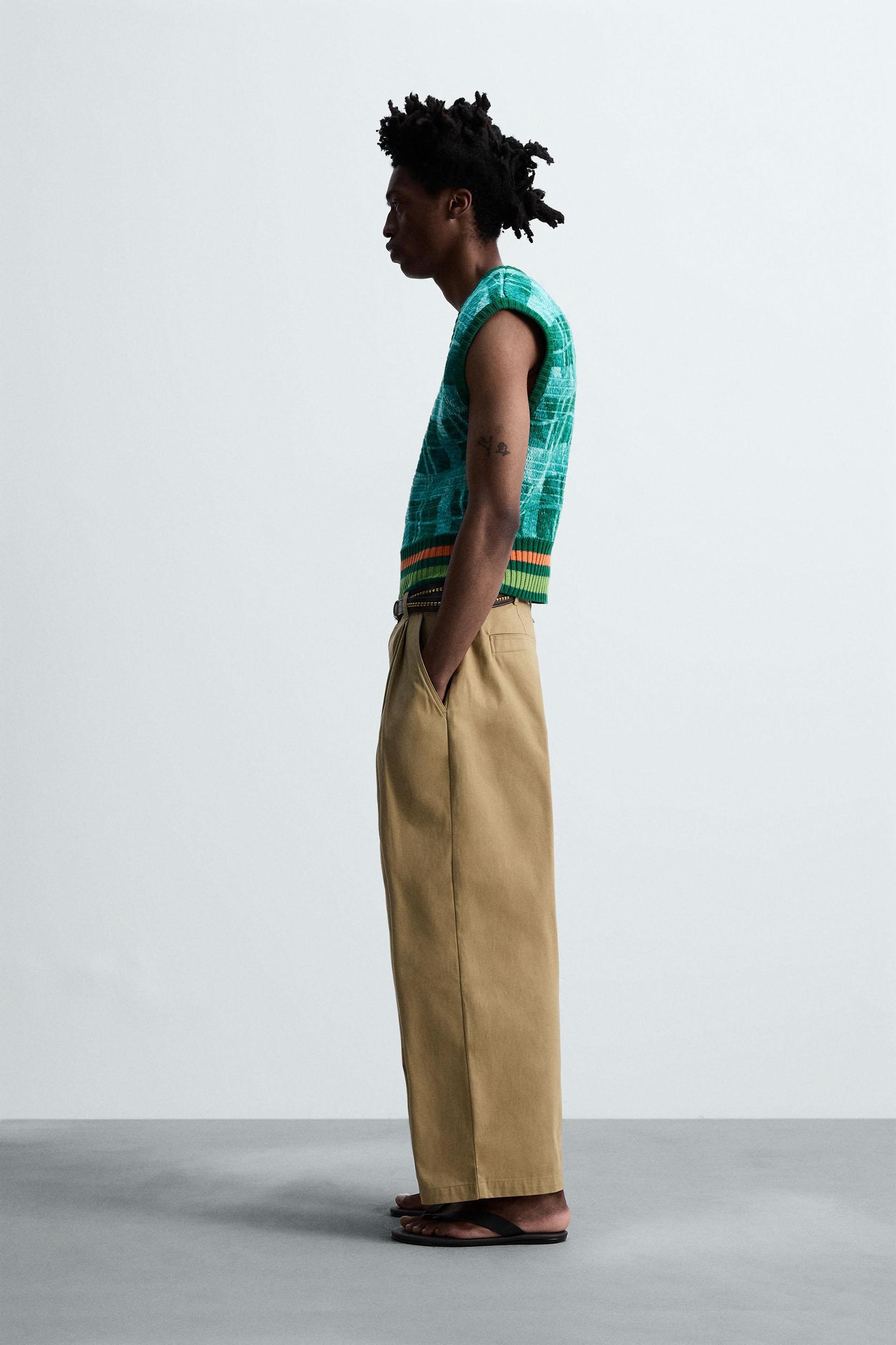 PLEATED WIDE FIT PANTS Product Image