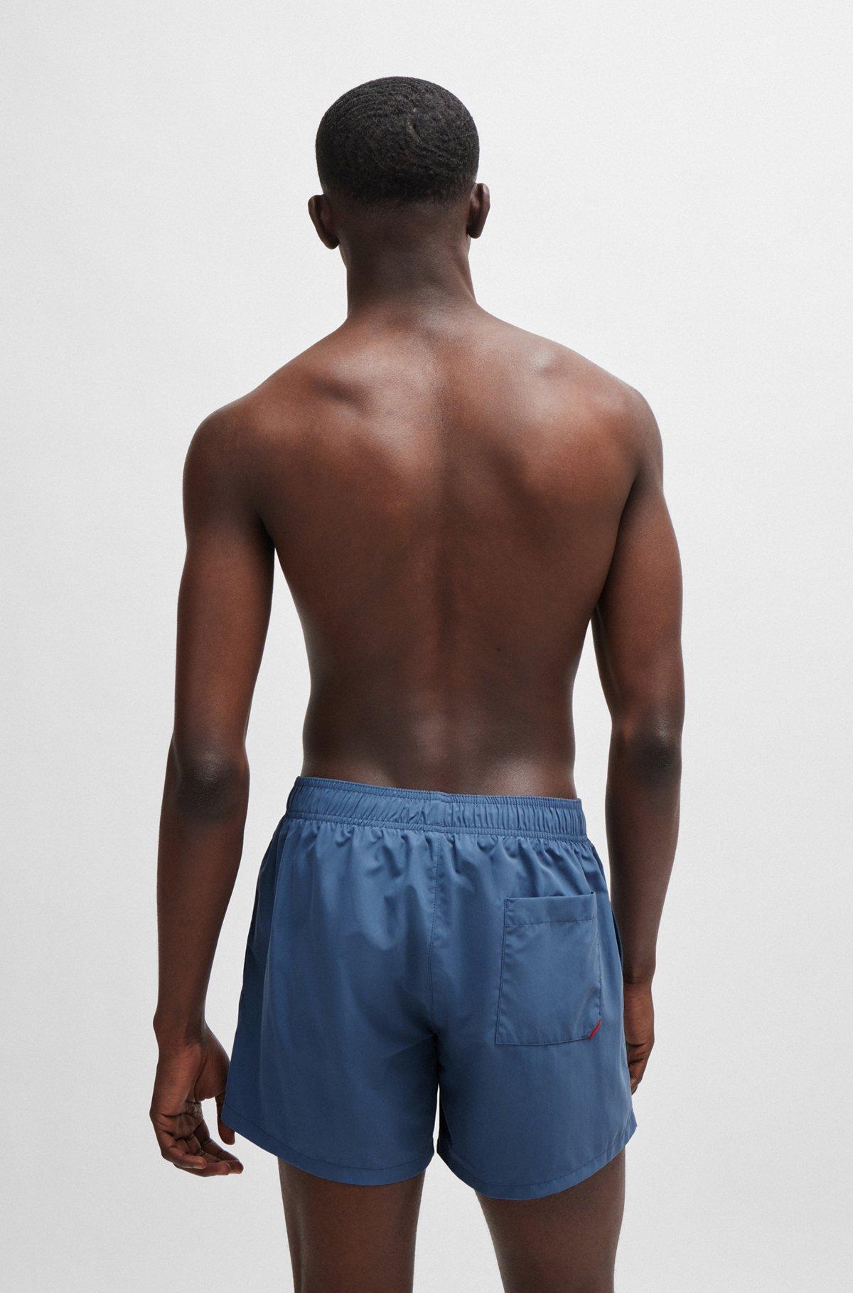 Fully lined swim shorts with vertical logo Product Image