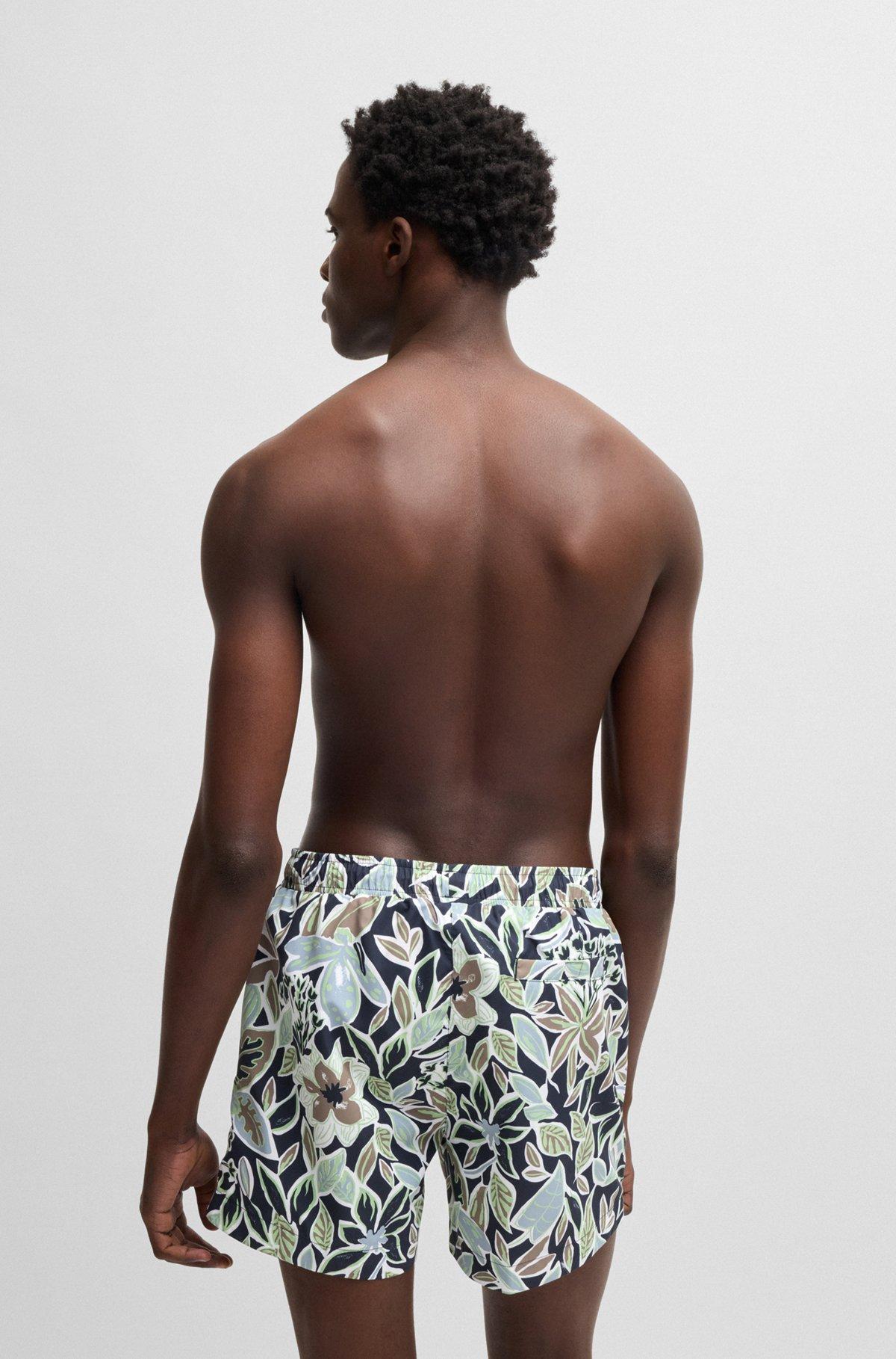 HUGO - Fully lined swim shorts with seasonal print - Dark Blue Product Image