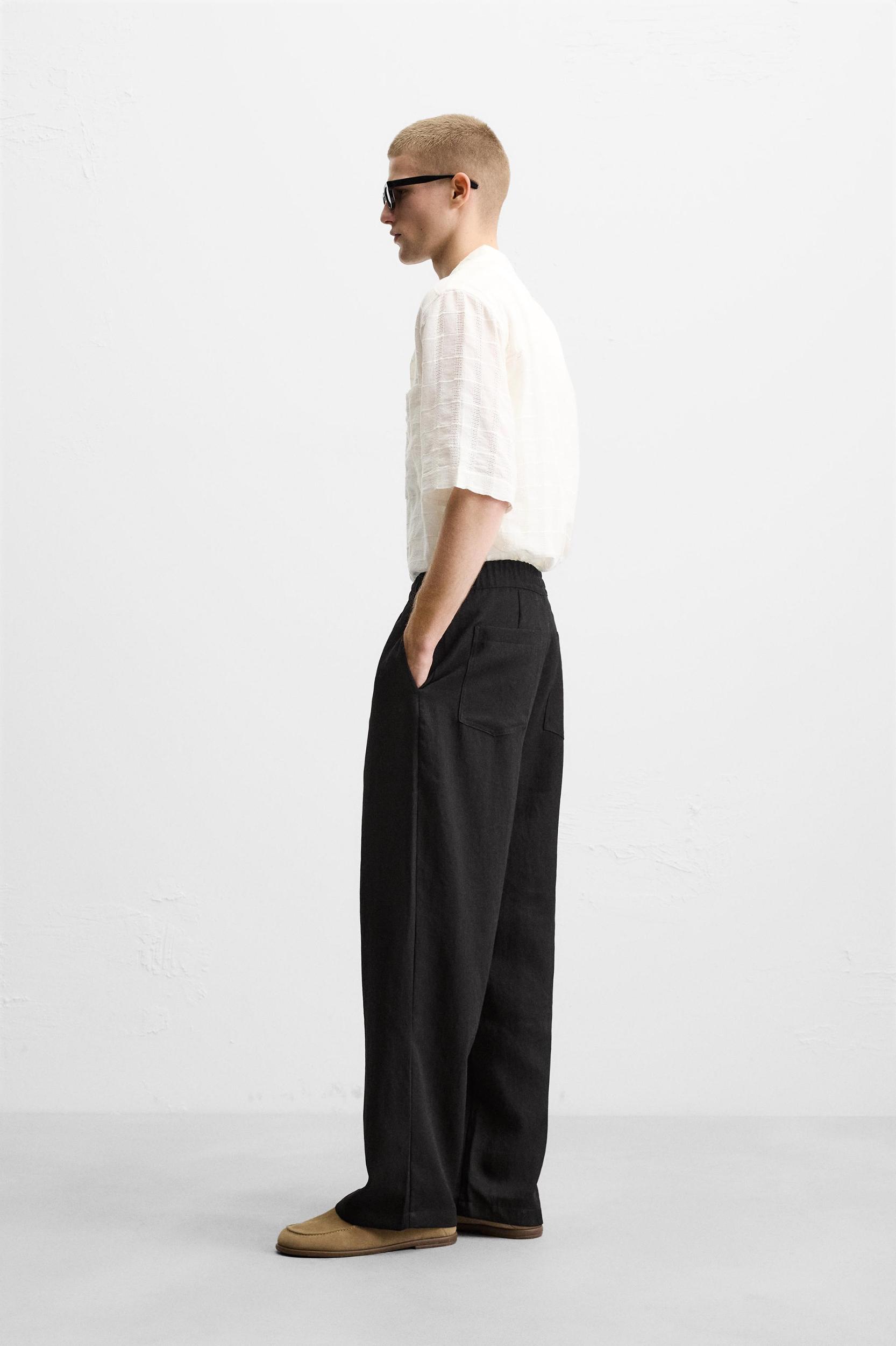 FLOWY PLEATED PANTS Product Image