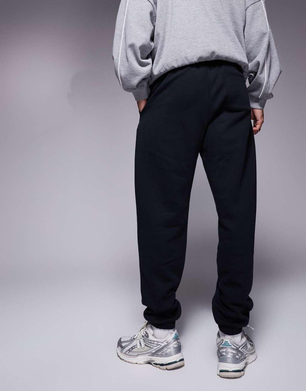 New Balance Sport Essentials Fleece track pants in black Product Image